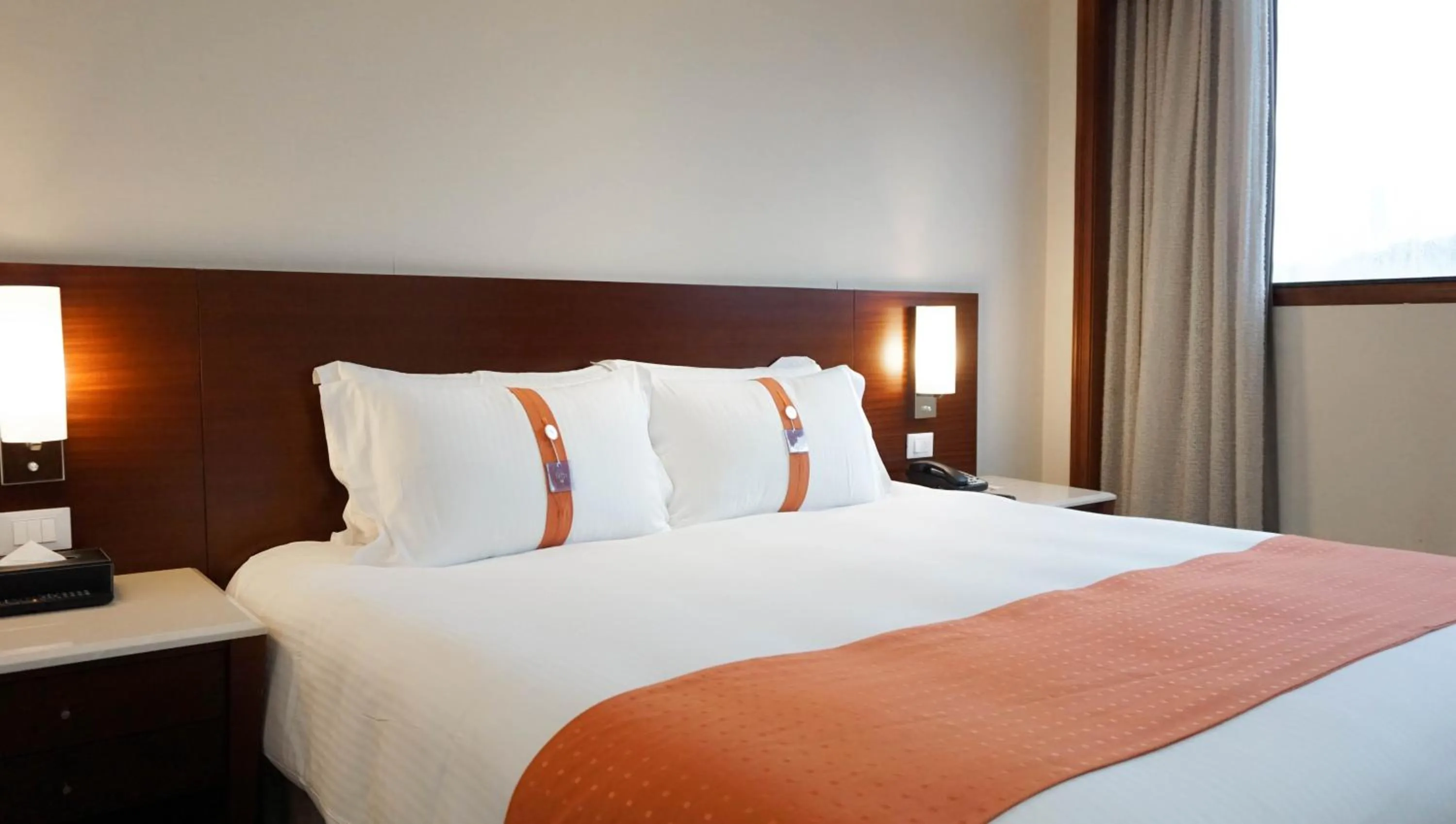 Bed in HiONE Holiday Hotel