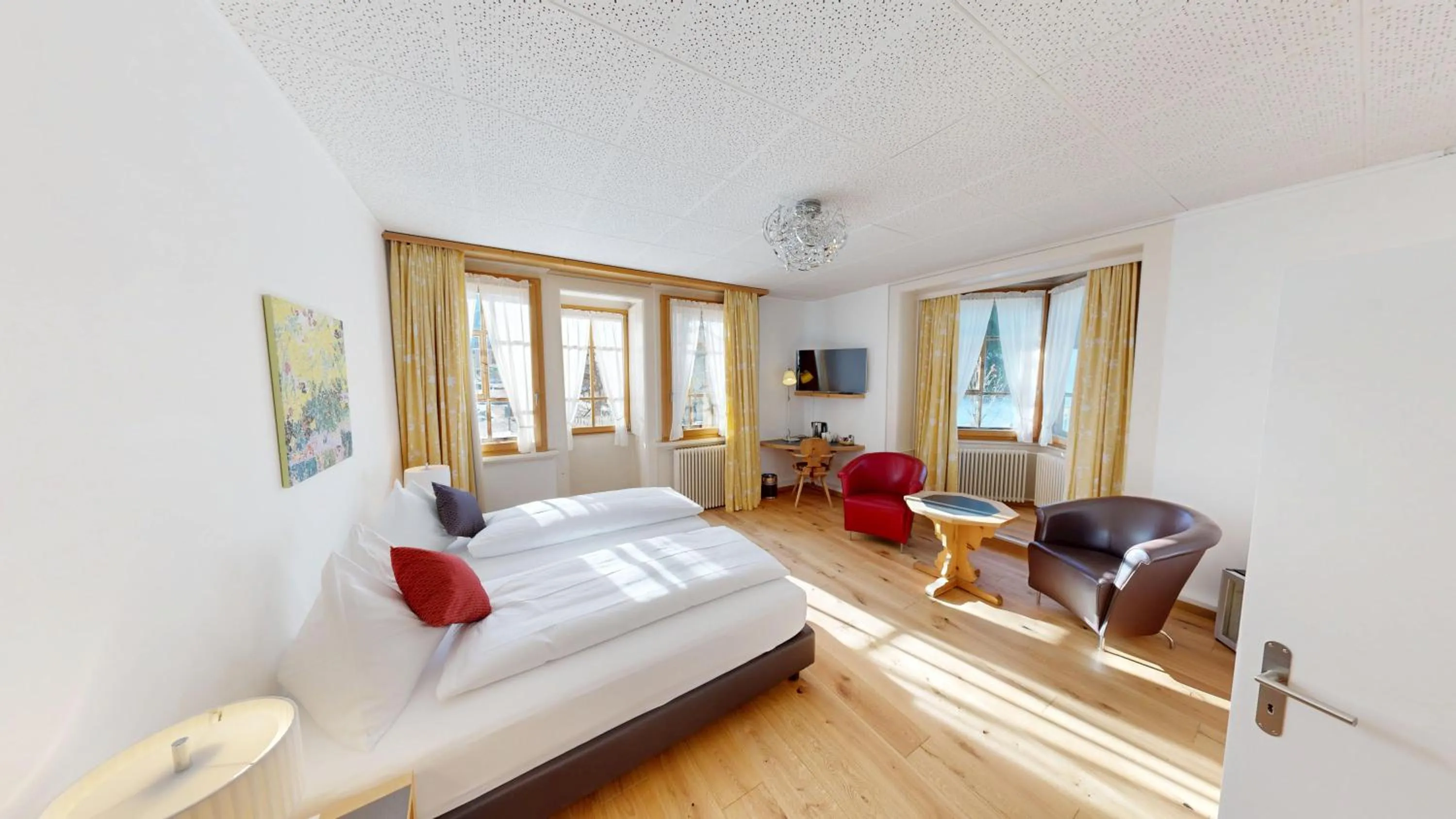 Bed in Schweizerhaus Swiss Quality Hotel