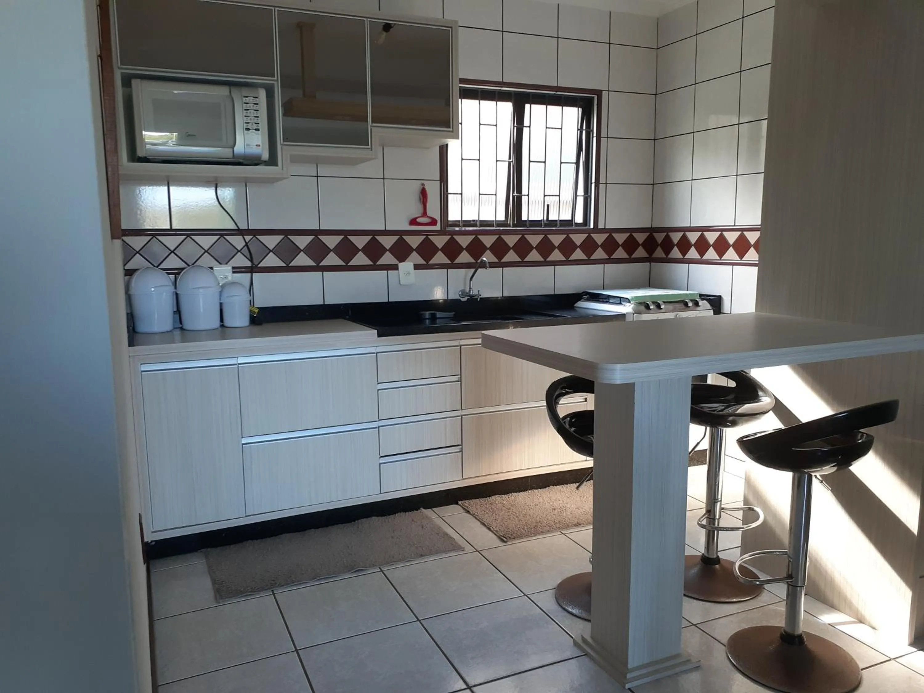 Kitchen or kitchenette in Casa da Marilú