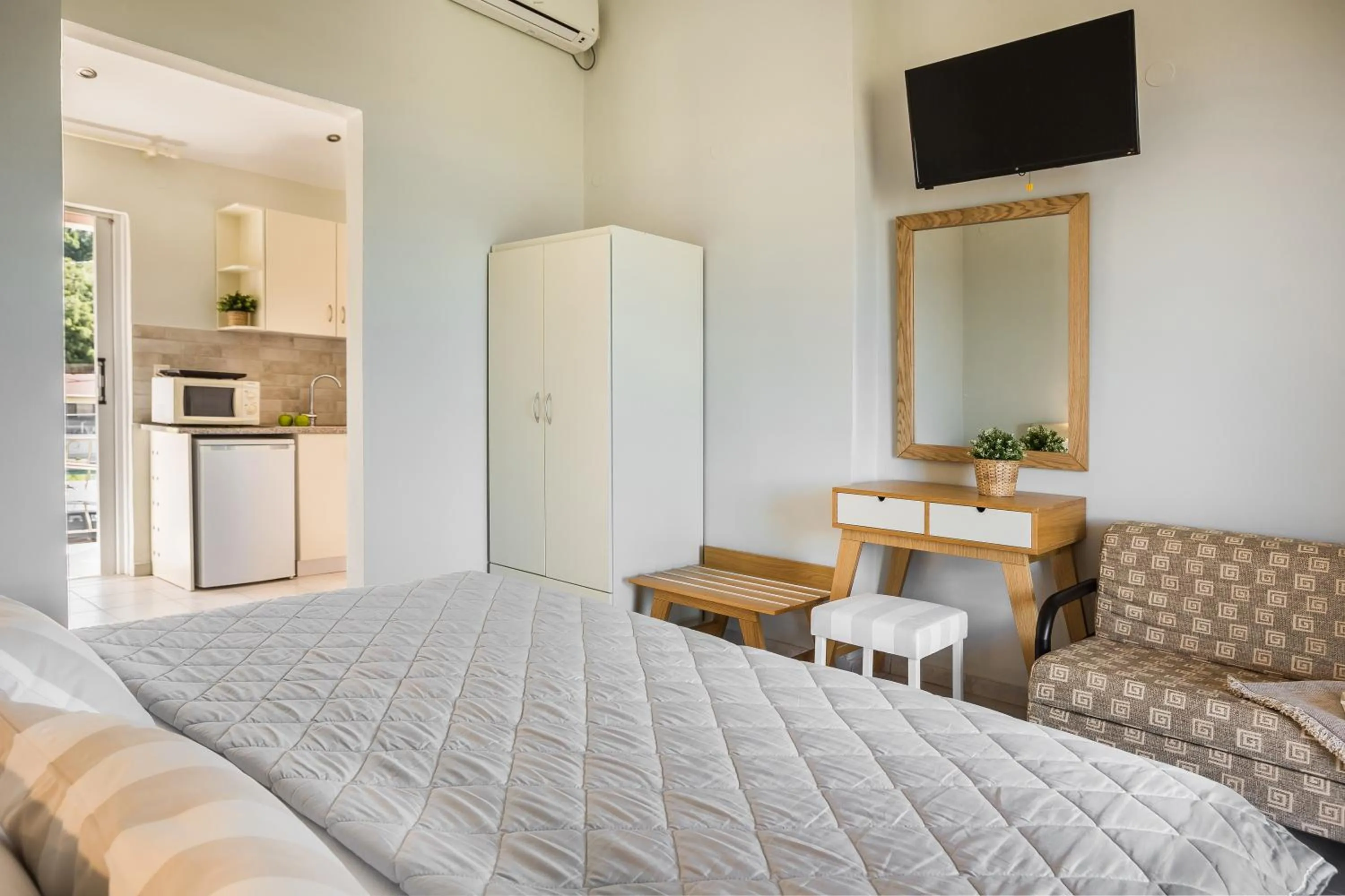 Bed in Panorama Fanari studios and apartments