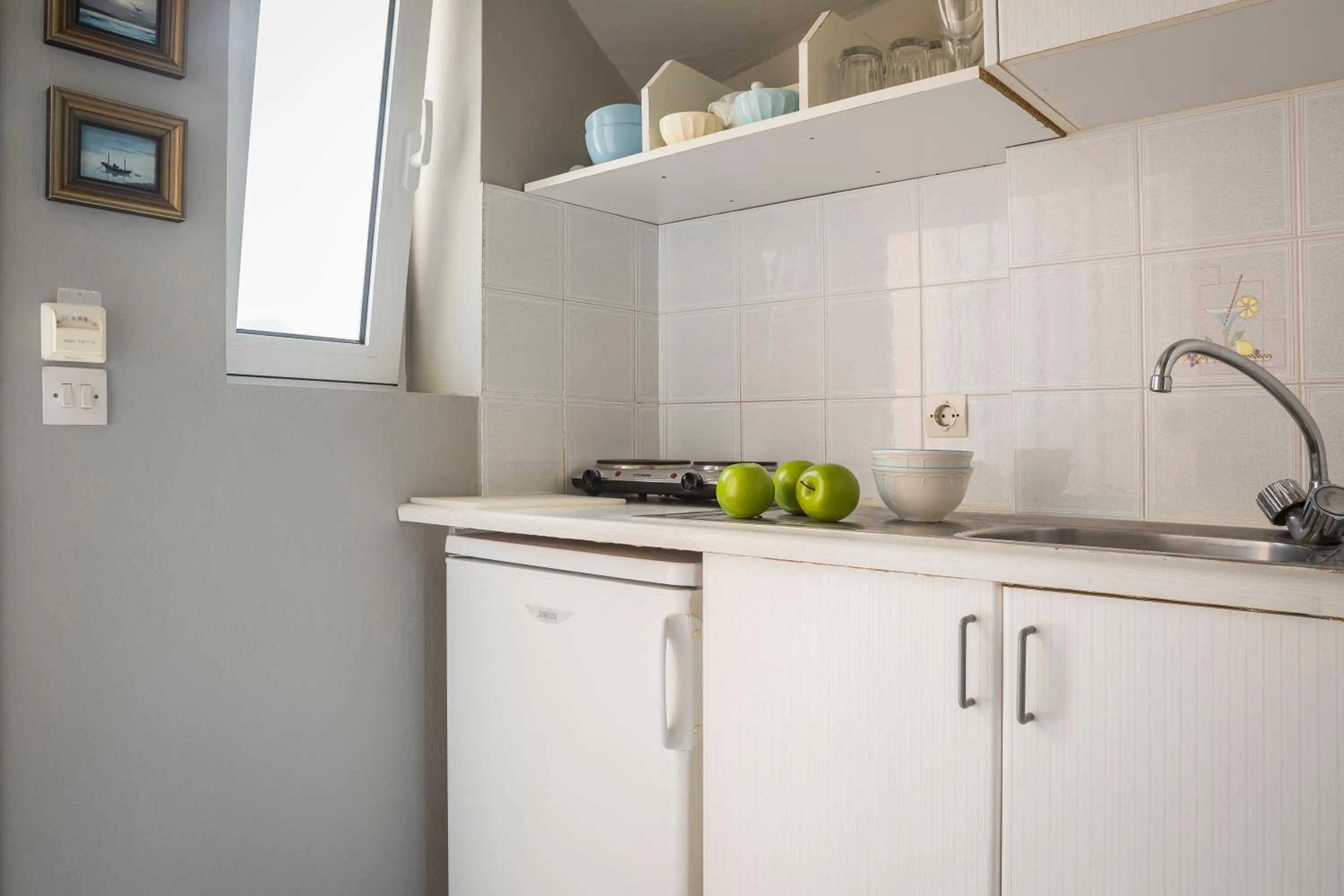 Kitchen or kitchenette in Panorama Fanari studios and apartments