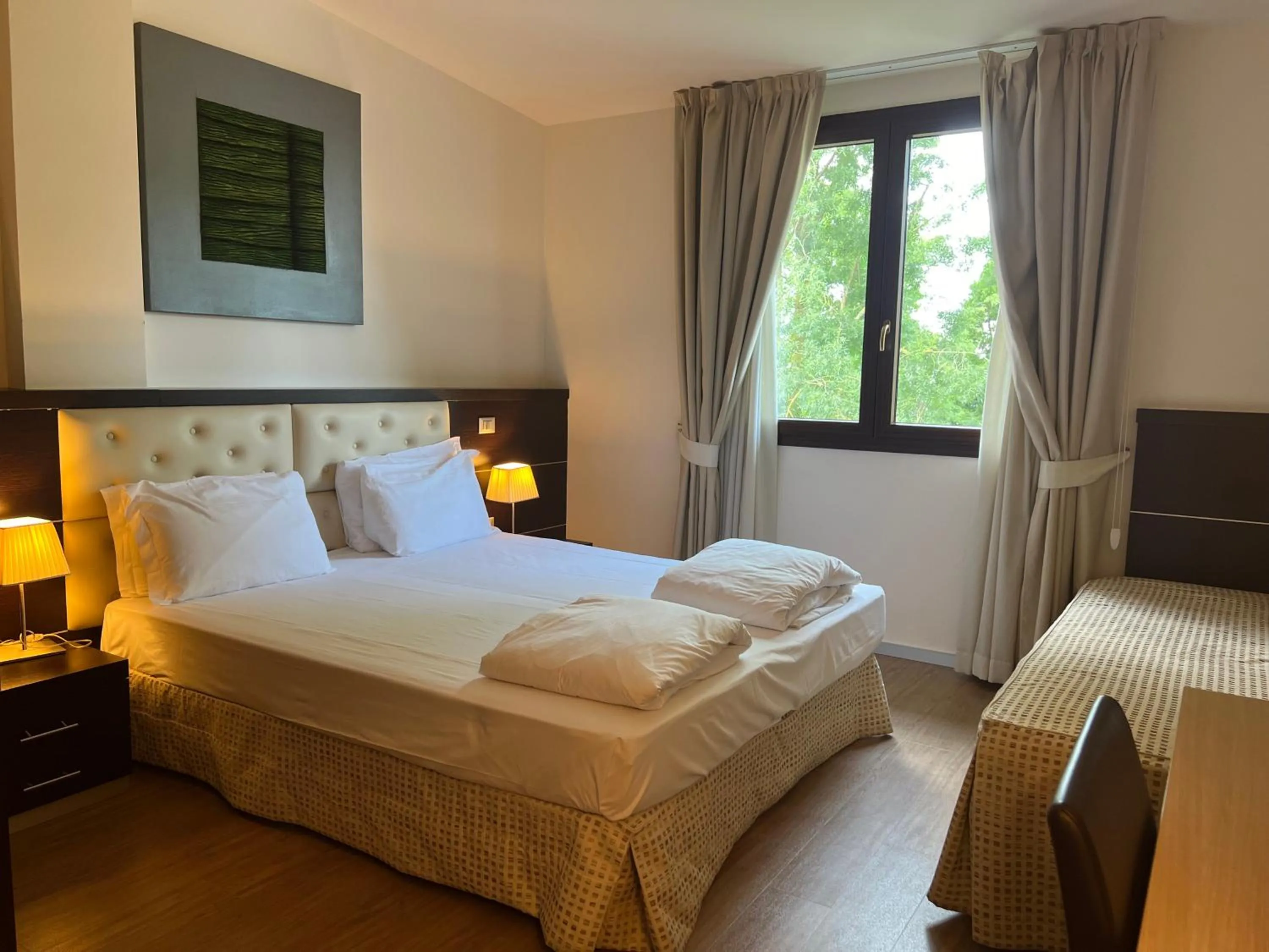 Bed in GREEN GARDEN Resort - Smart Hotel