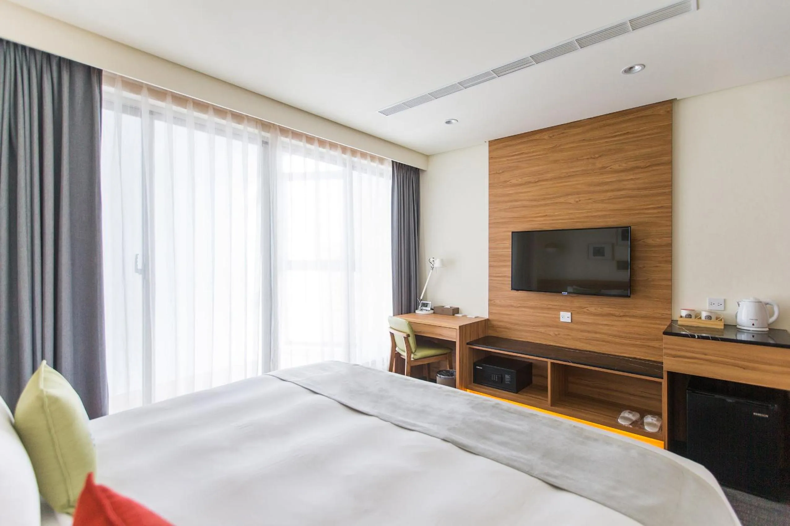 Photo of the whole room, Bed in Sun Dialogue Hotel-By Cosmos Creation