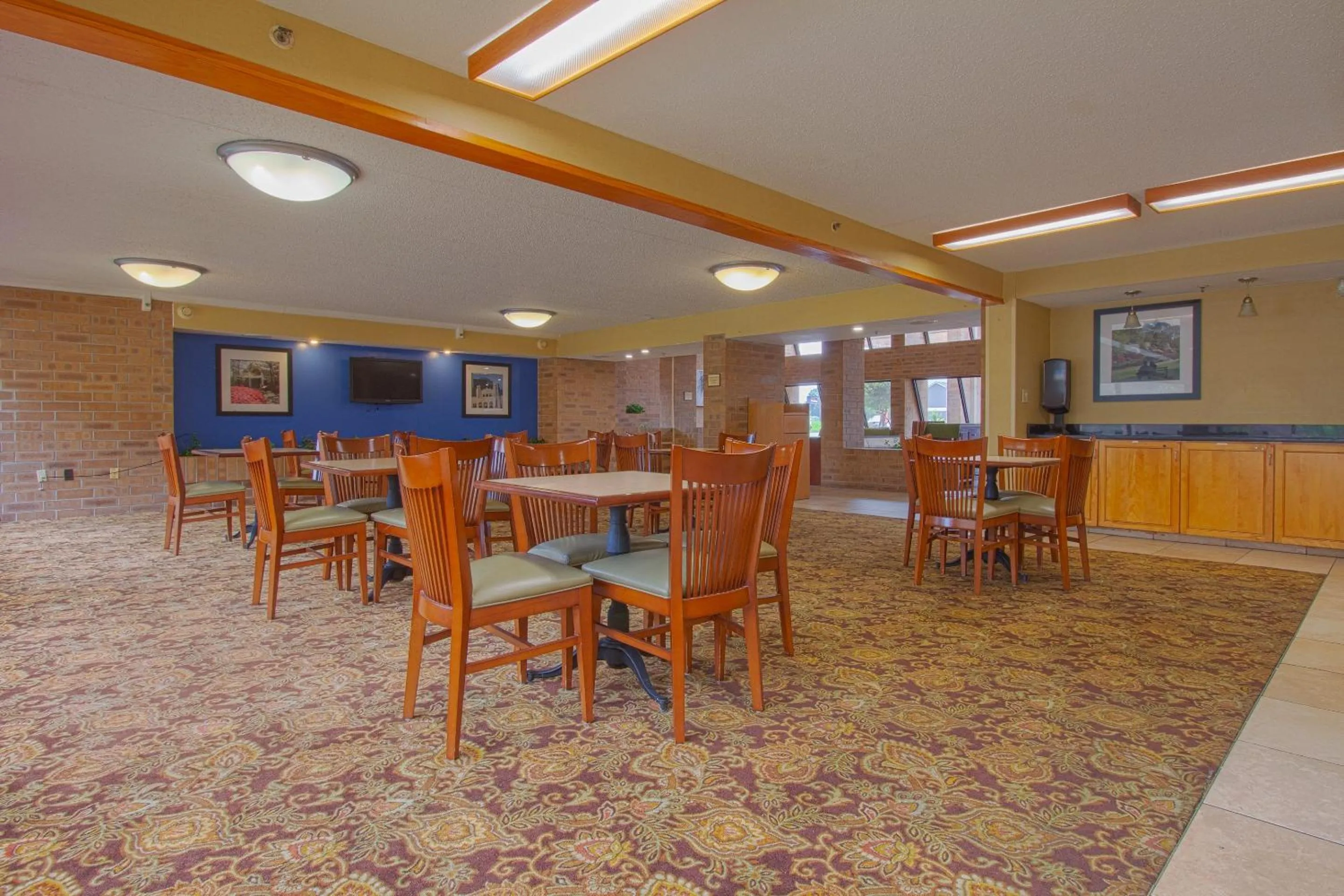 Dining area in Tulsa Square Hotel Central, I-44 By OYO