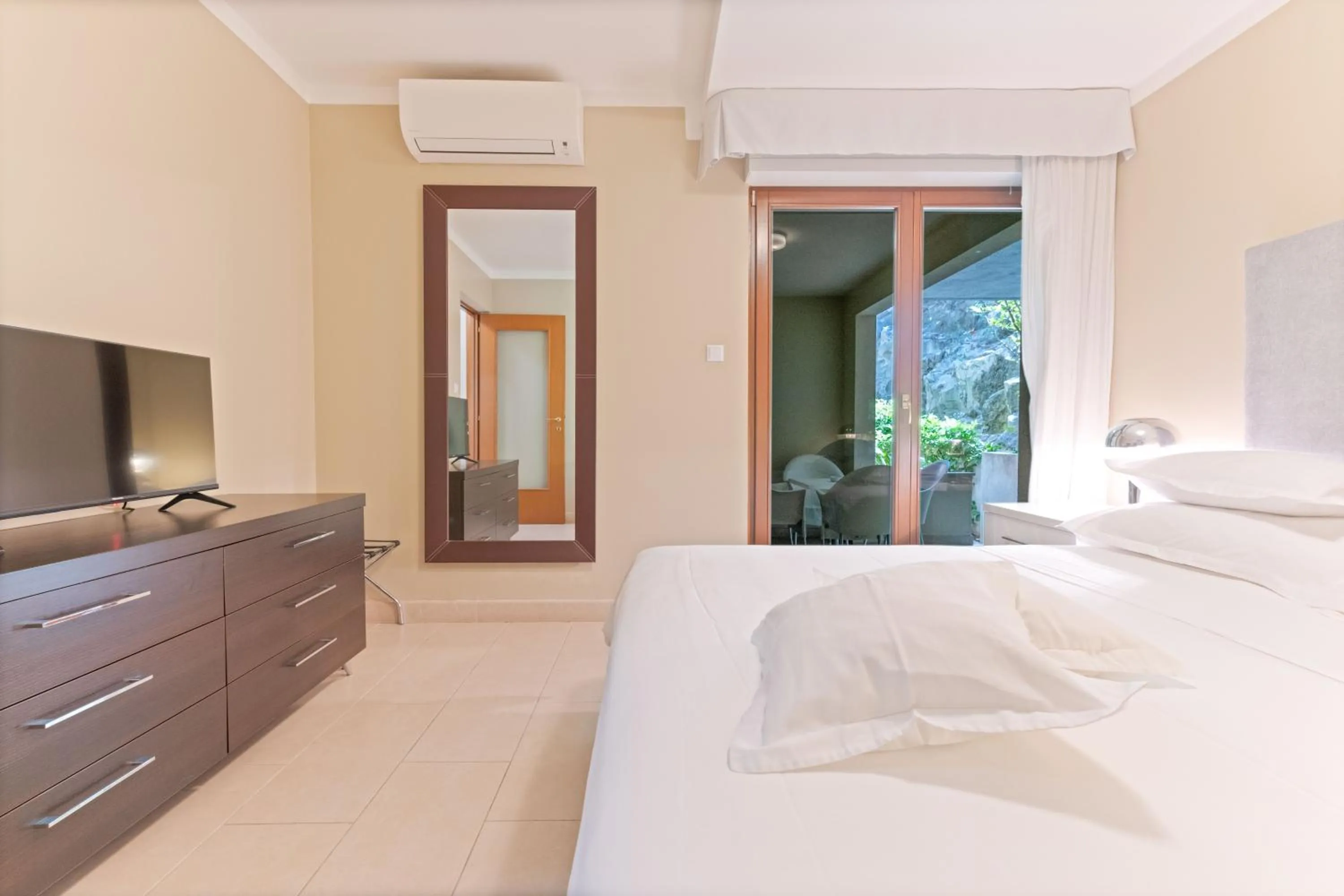 Bed in The Residence Aparthotel