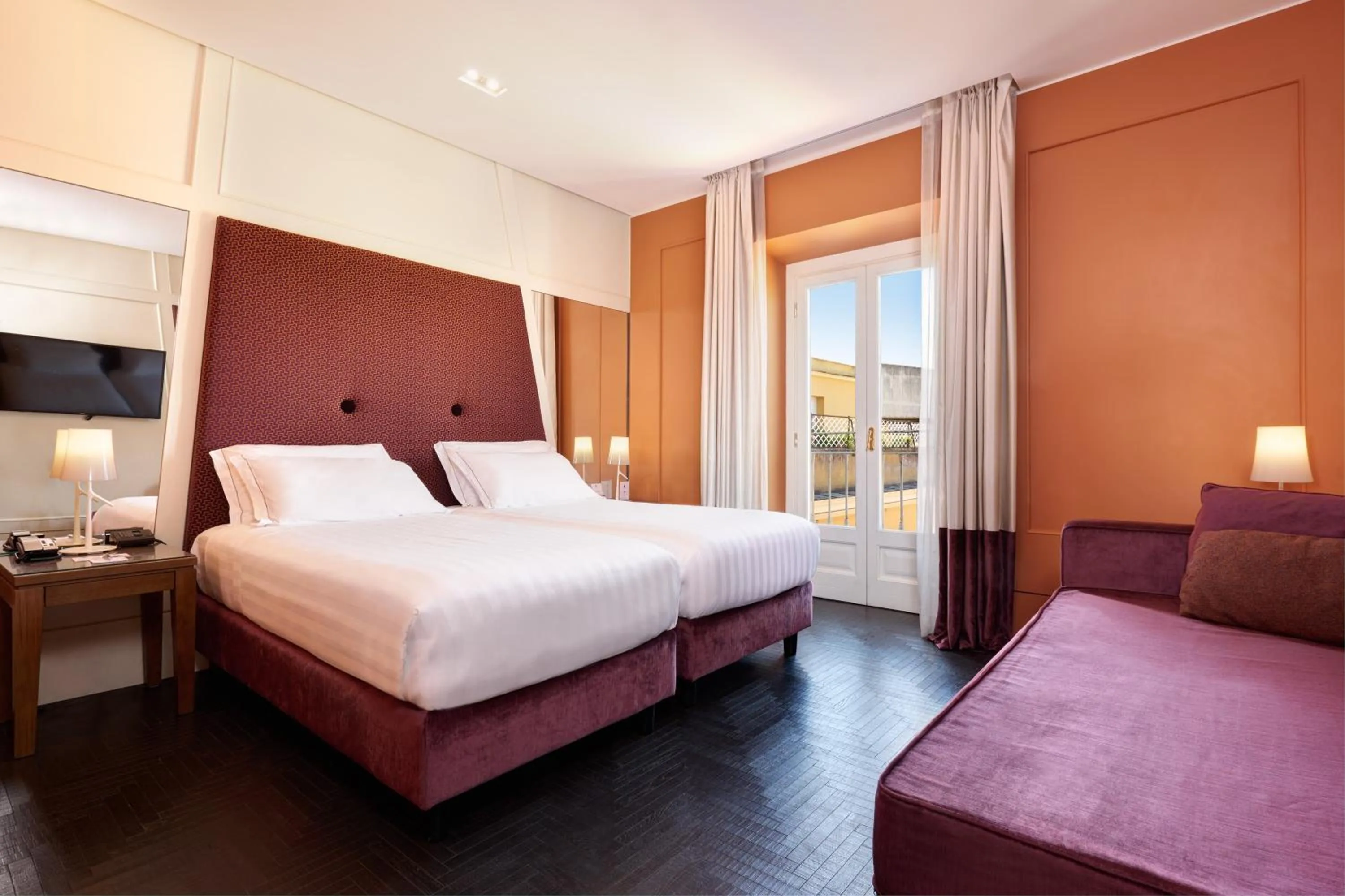 Bed in Mascagni Luxury Rooms & Suites