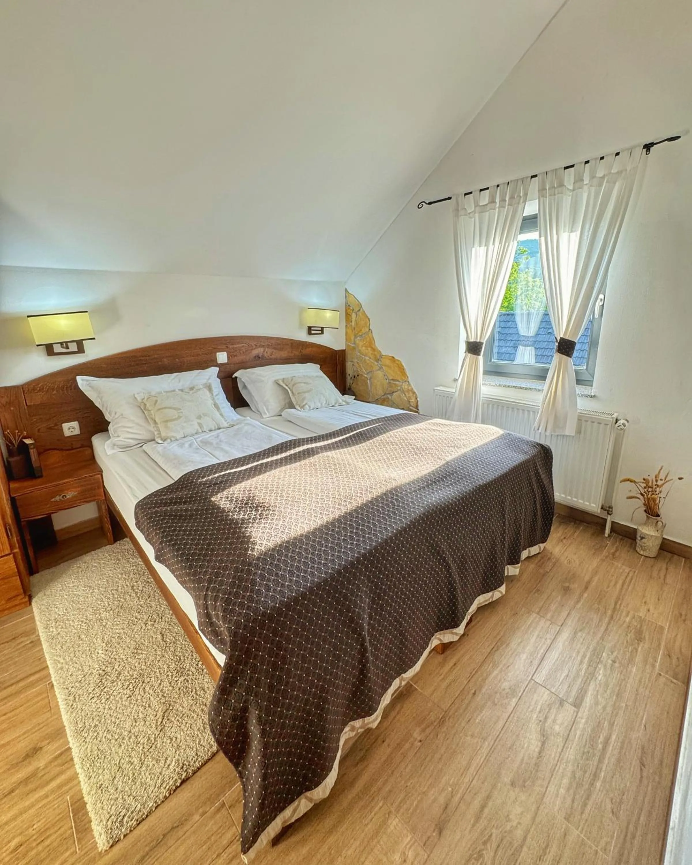 Bed in Etno Garden Apartments