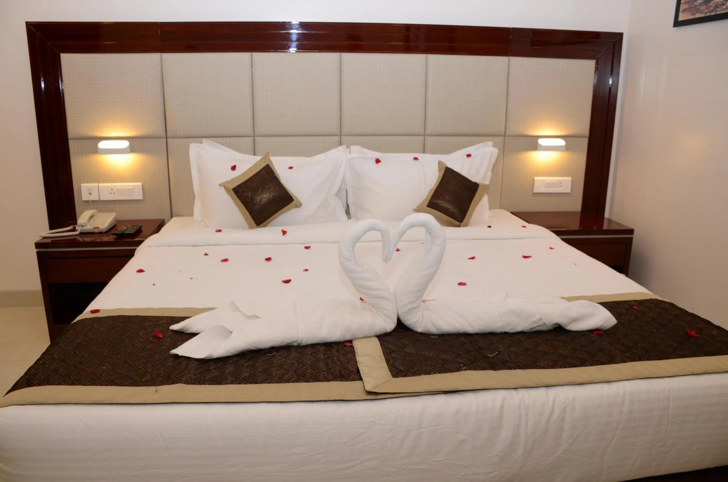 Bed in The AVR Hotels & Banquets