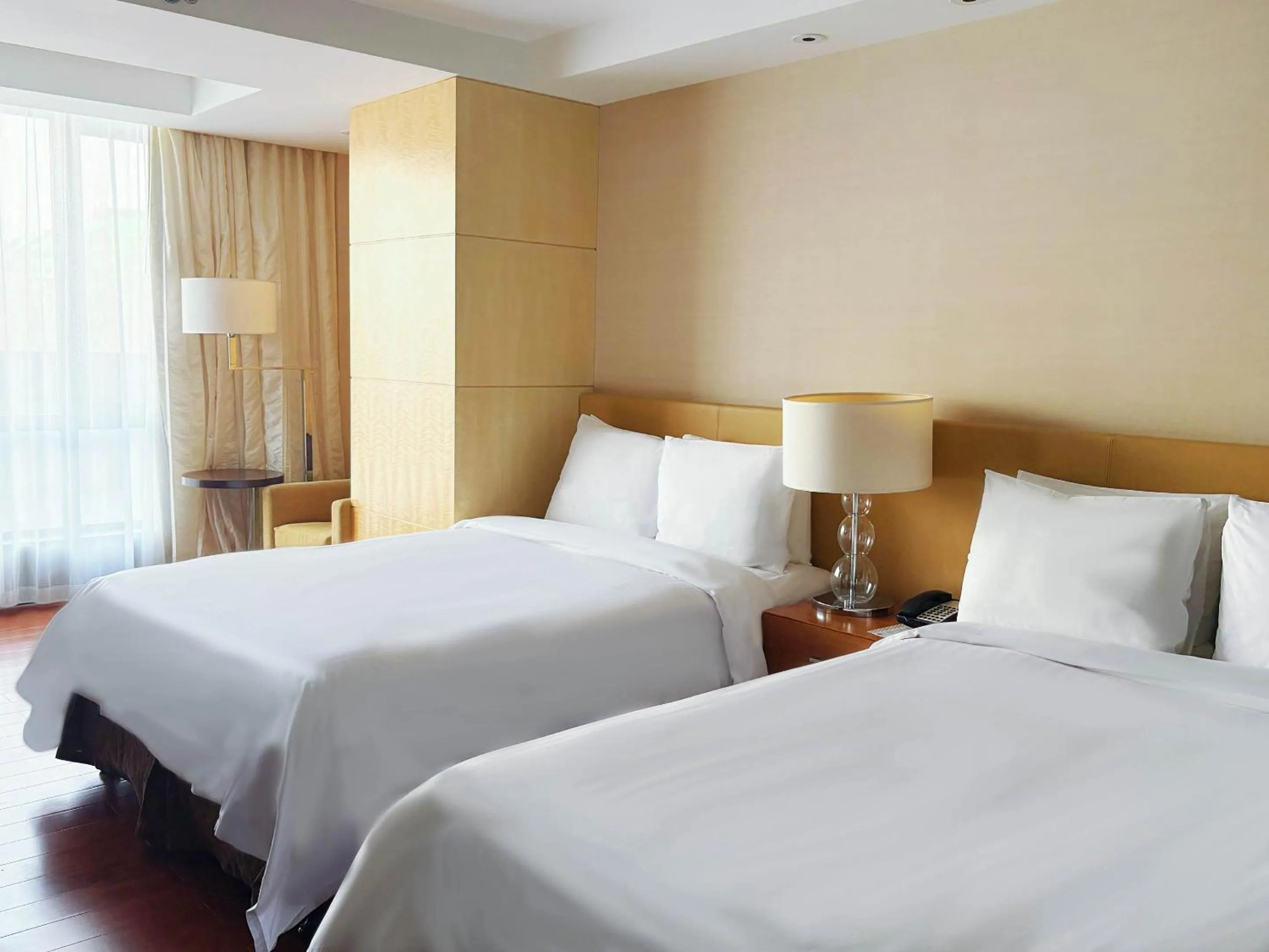 Bed in The Sandalwood Beijing Marriott Executive Apartments