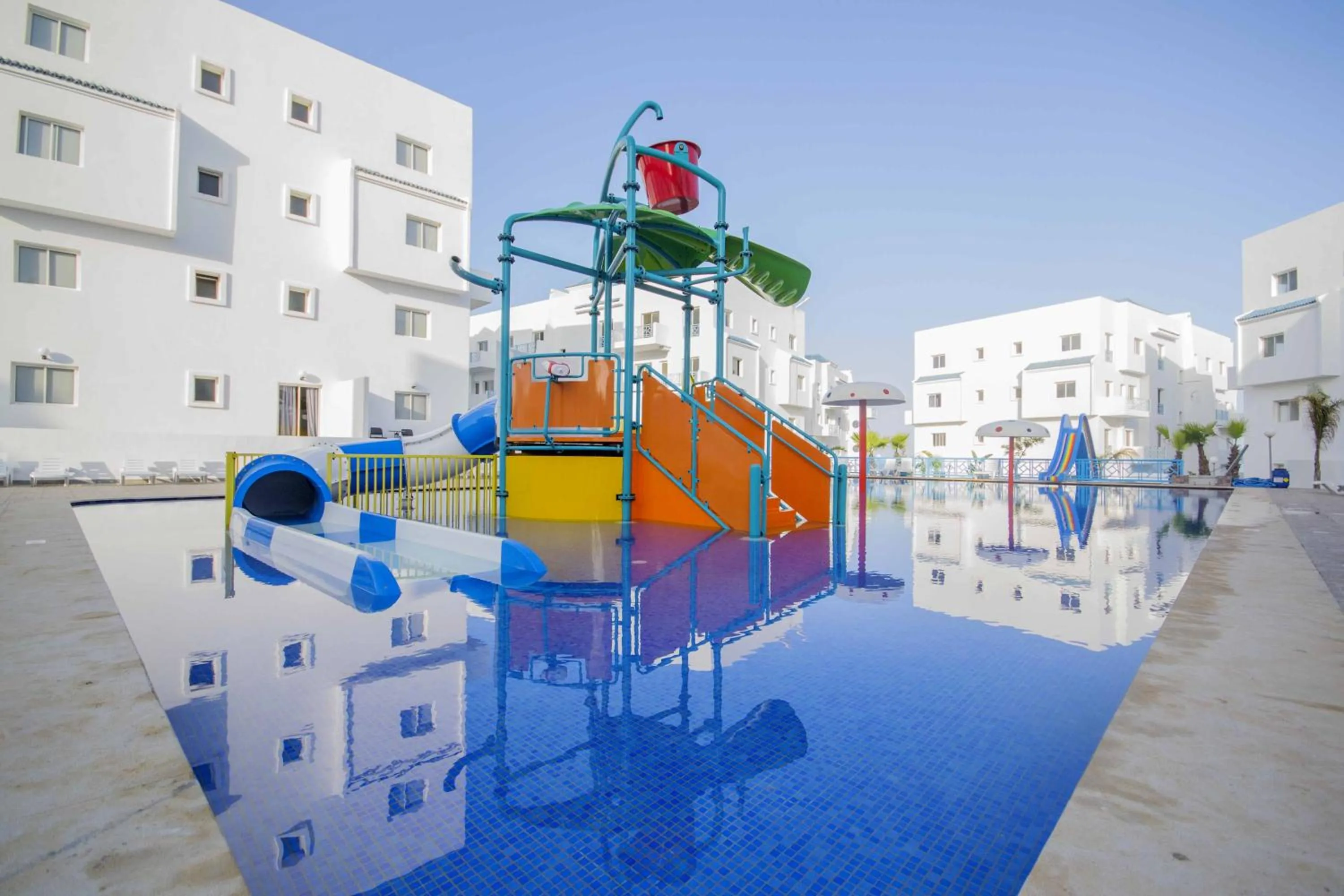 Swimming pool in L'escale Appart-hôtel By 7AV HOTELS