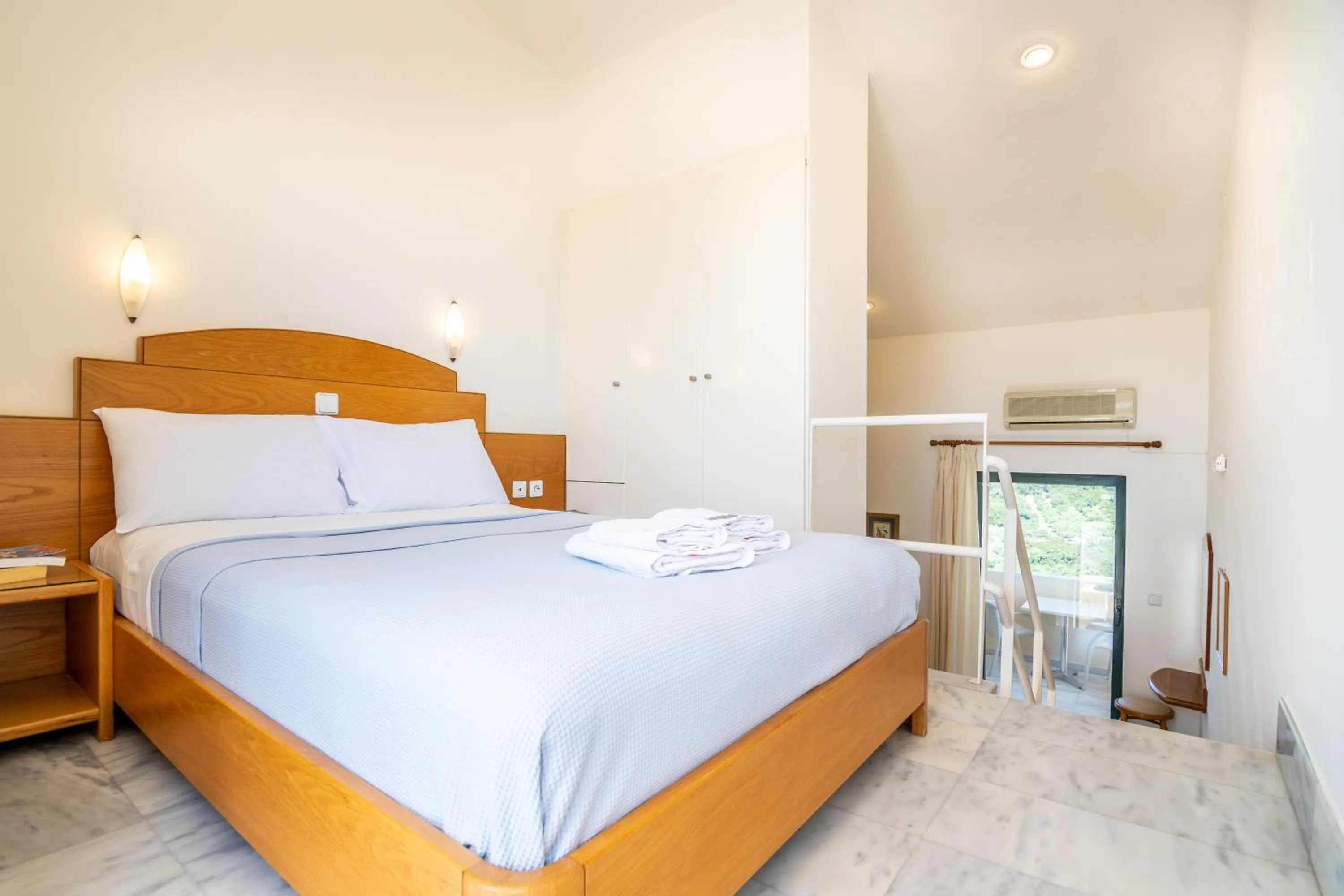 Bed in Orestis Hotel Sea View Apartments