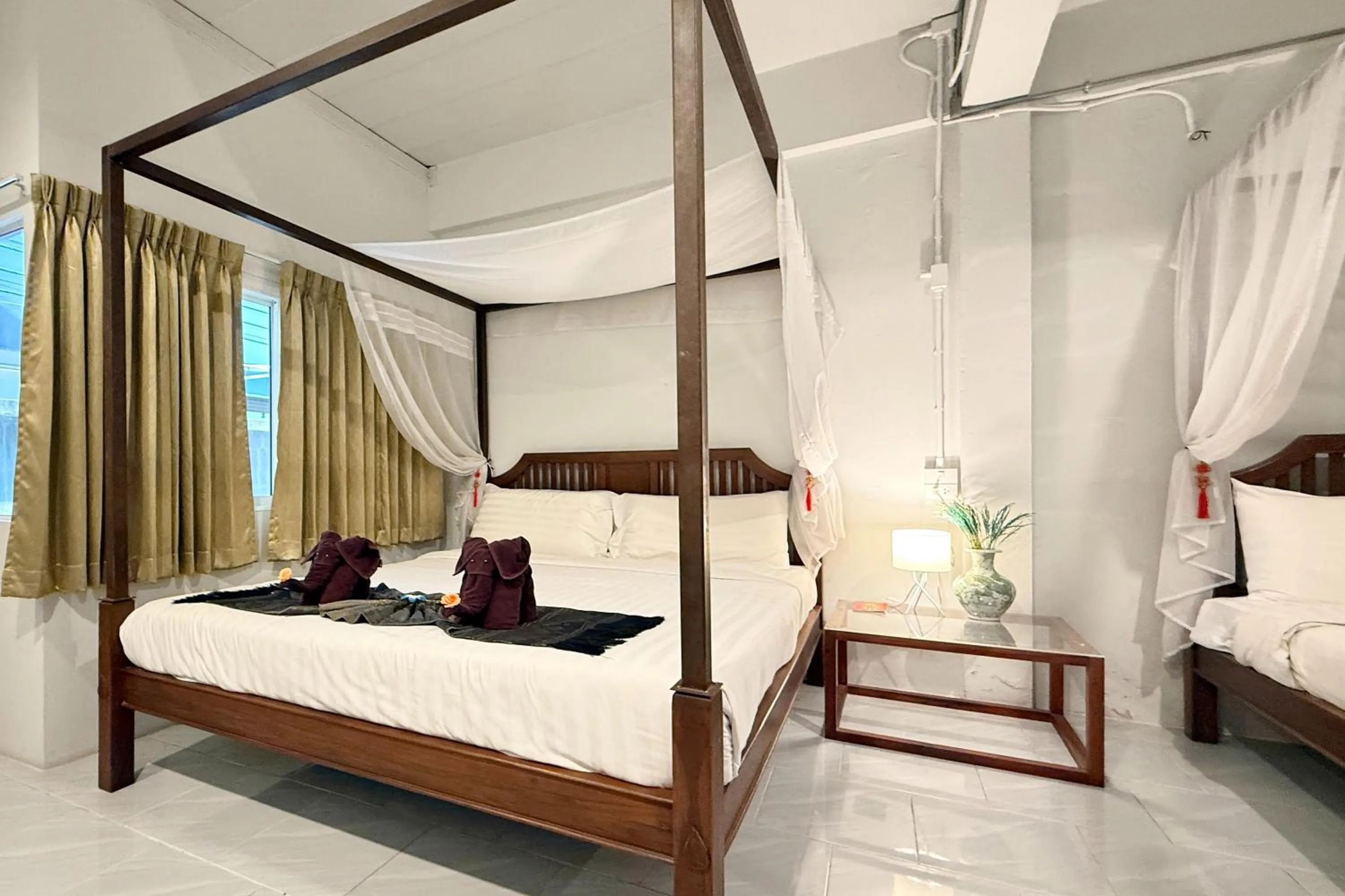 Bed in Sabaidee Chiangmai Hotel