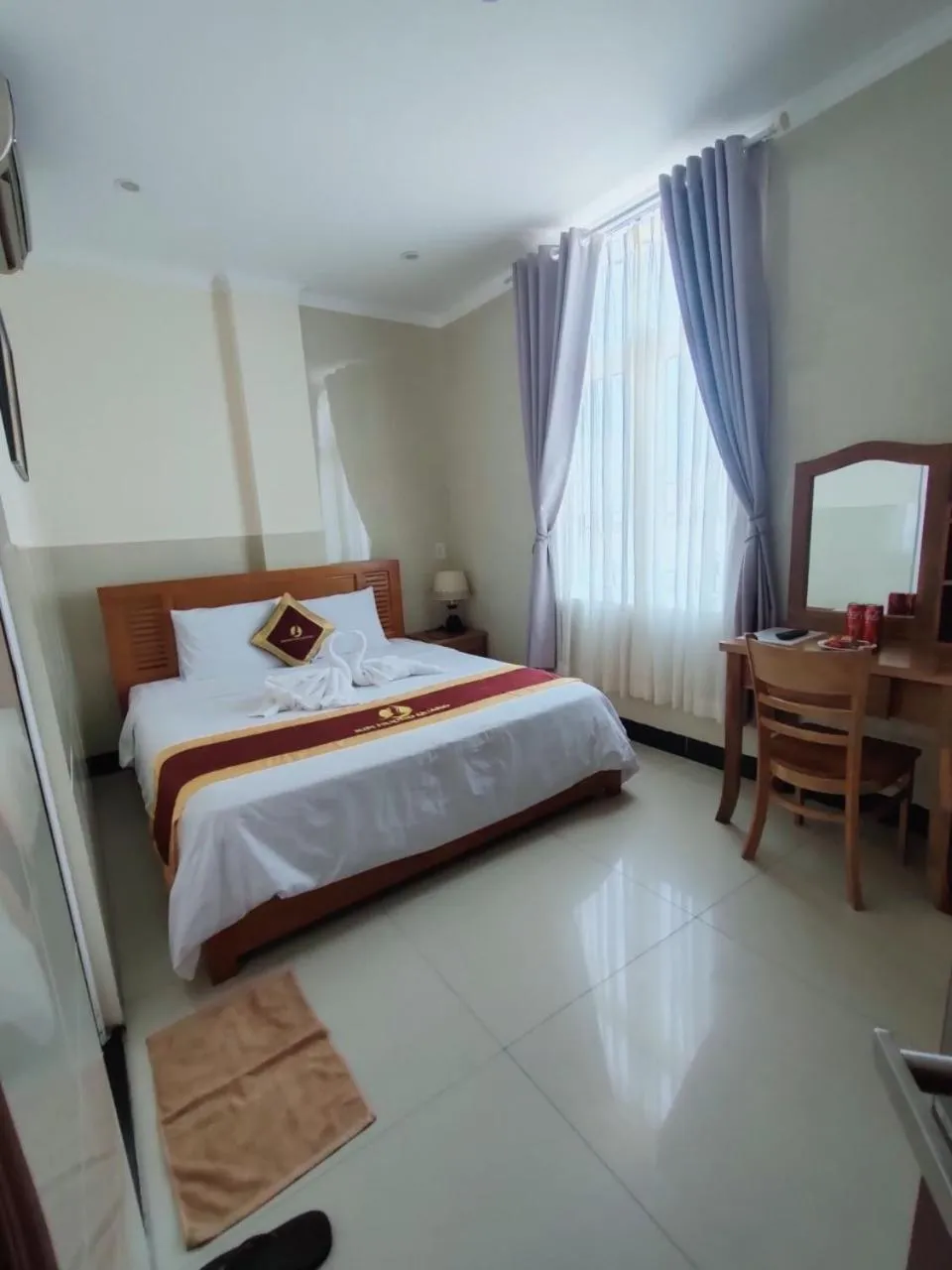 Bed in Kim Huong Quang Hotel