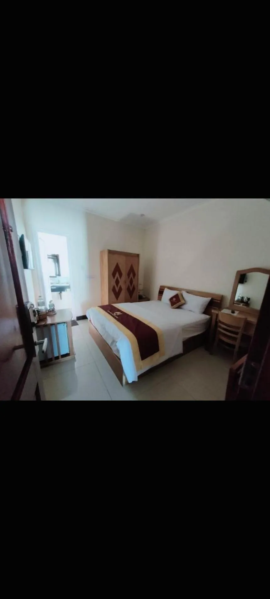 Bed in Kim Huong Quang Hotel