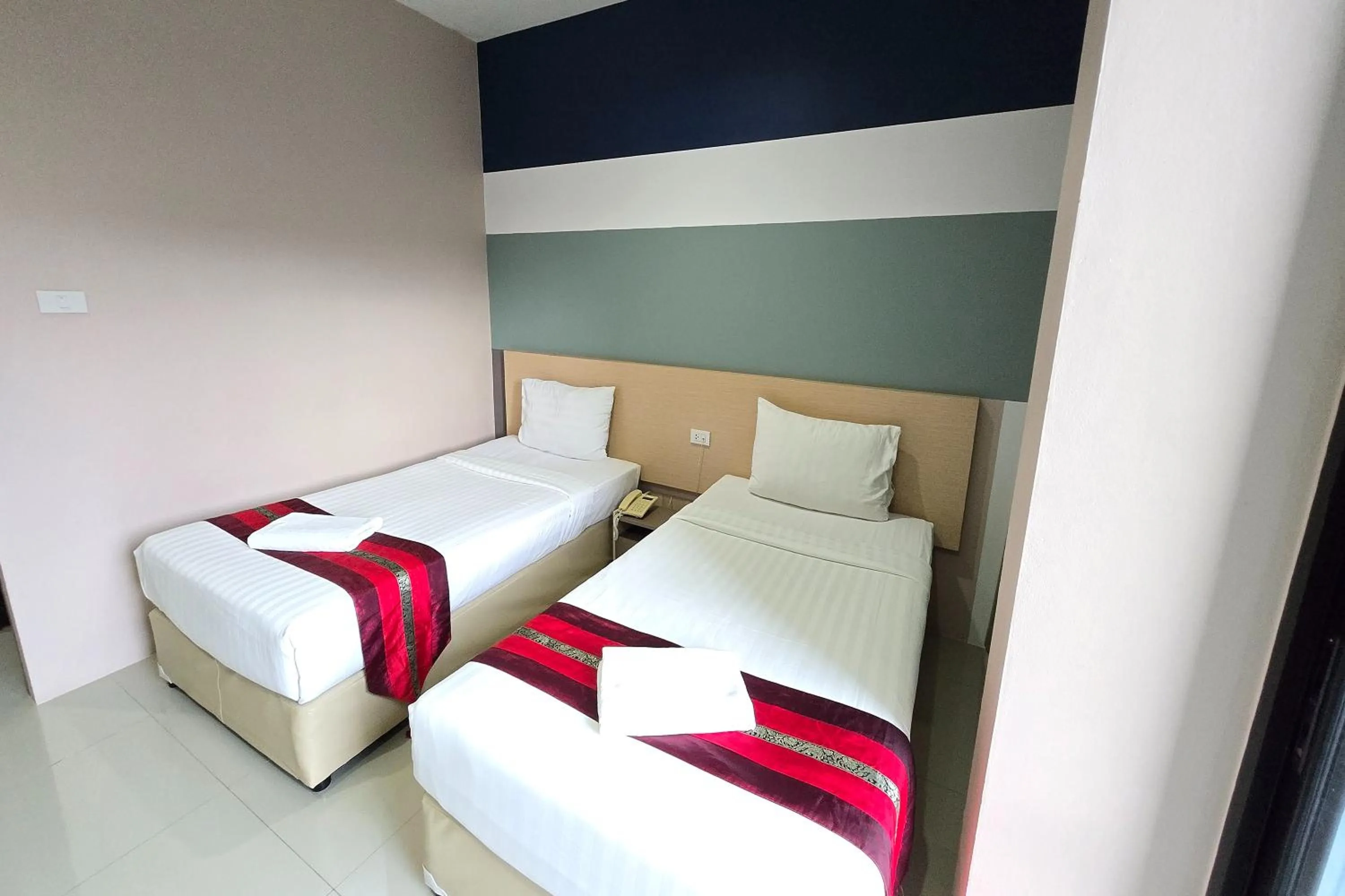 Bed in JJ Residence Phuket Town