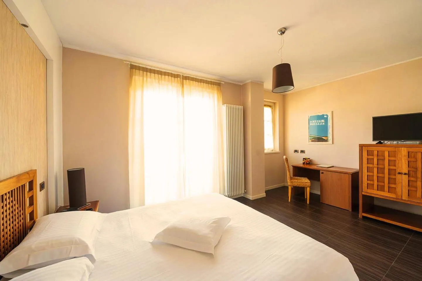 Bed in T'AMI Hotel Resort Spa