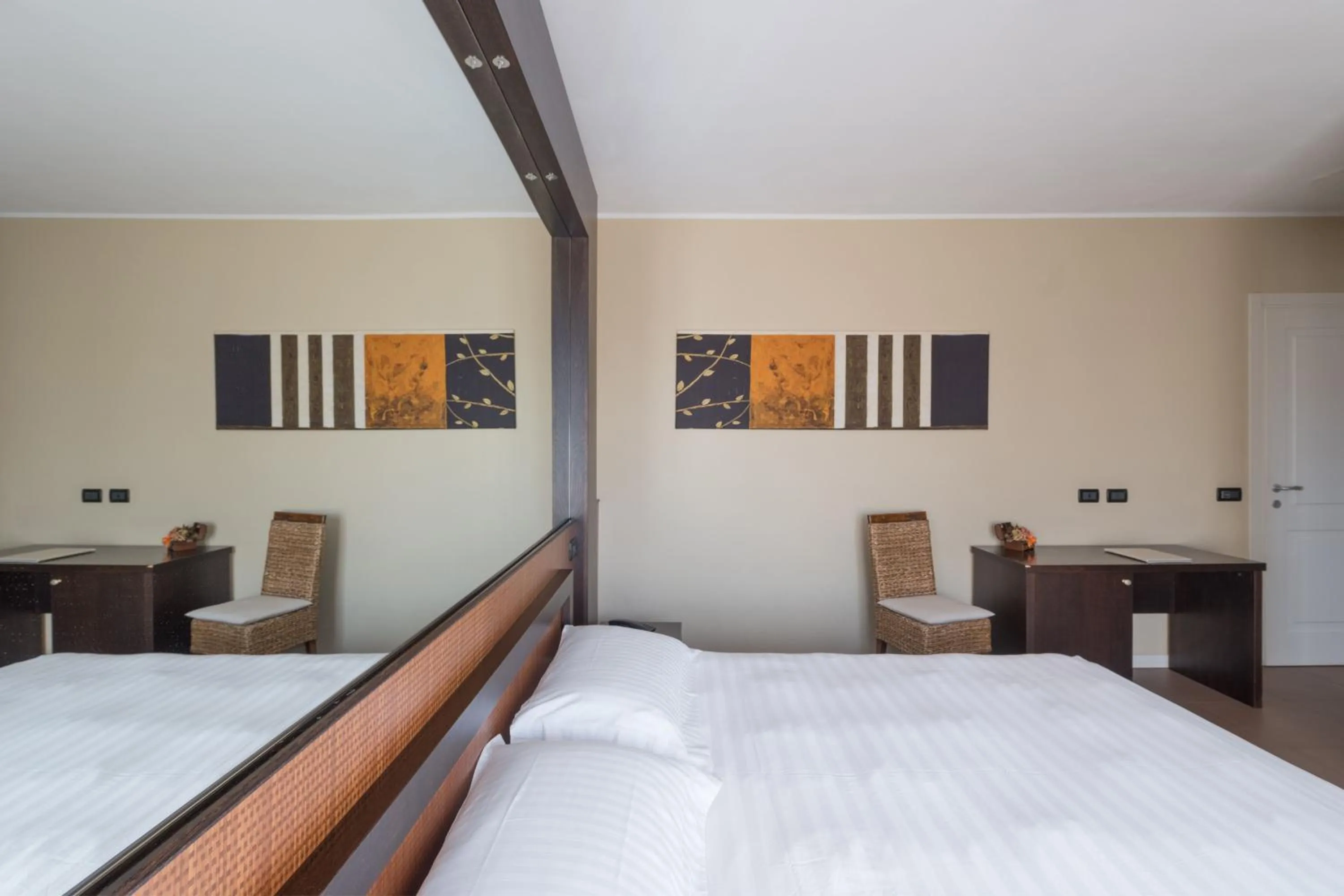 Bed in T'AMI Hotel Resort Spa