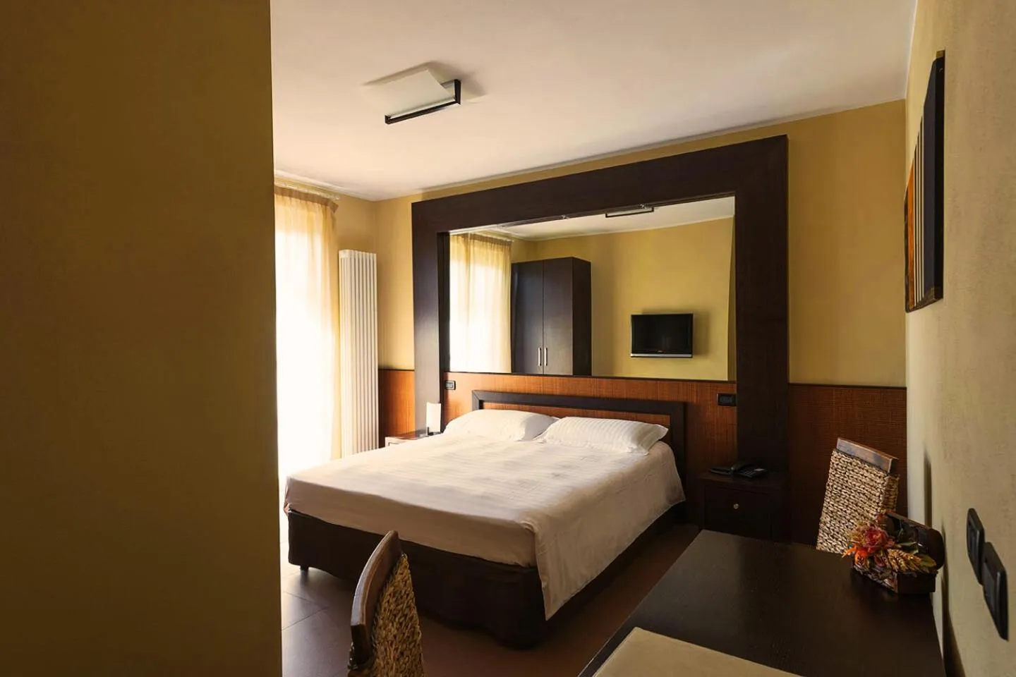 Bed in T'AMI Hotel Resort Spa