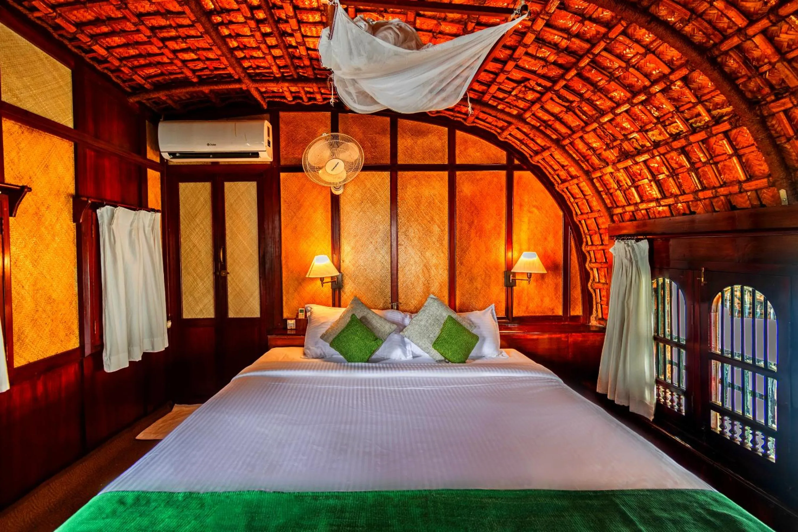 Photo of the whole room, Bed in Spice Coast Cruises - Houseboat, A CGH Earth Experience