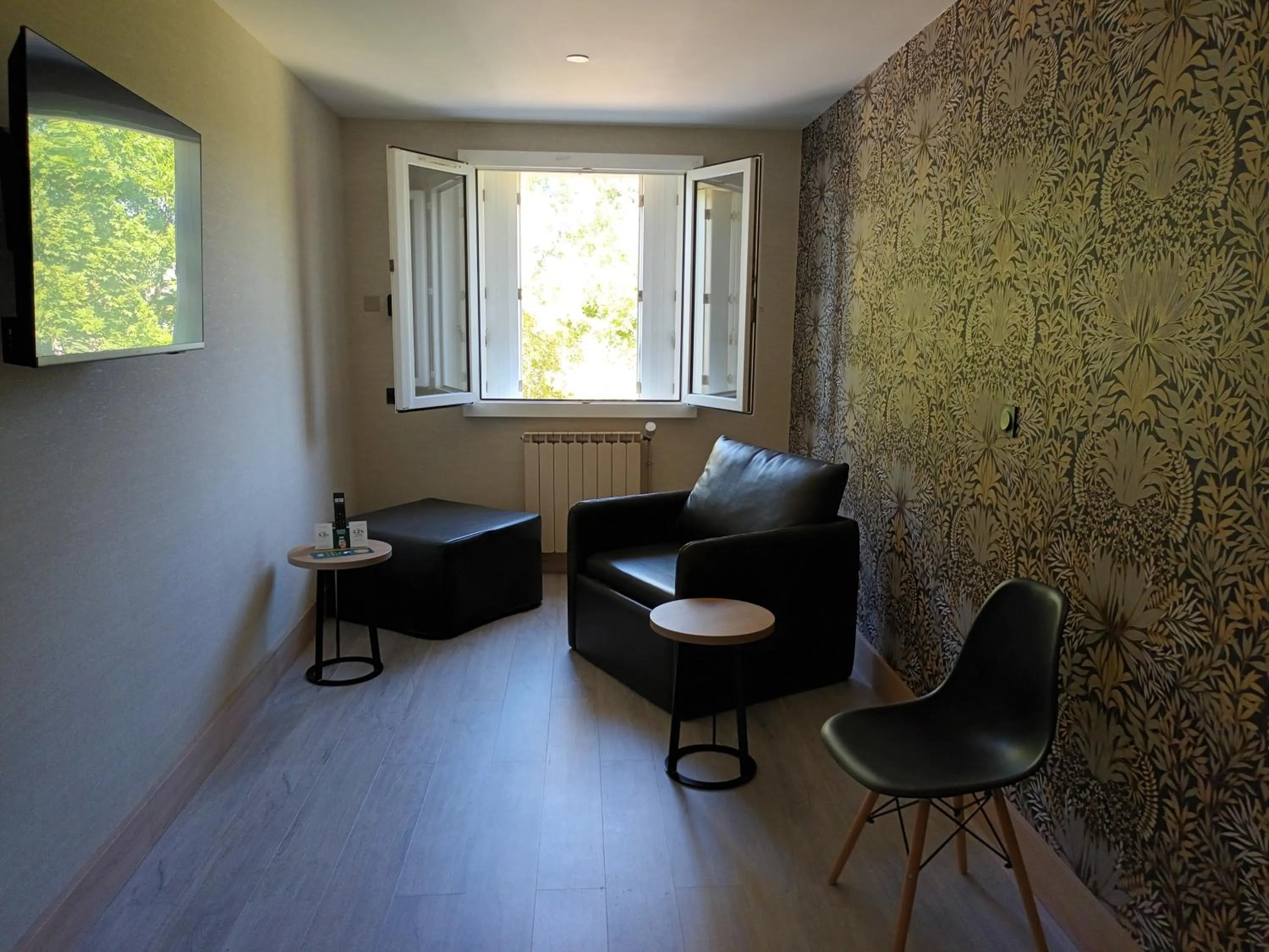 Seating area in Hôtel-Restaurant Logis l'Aubrac Laguiole