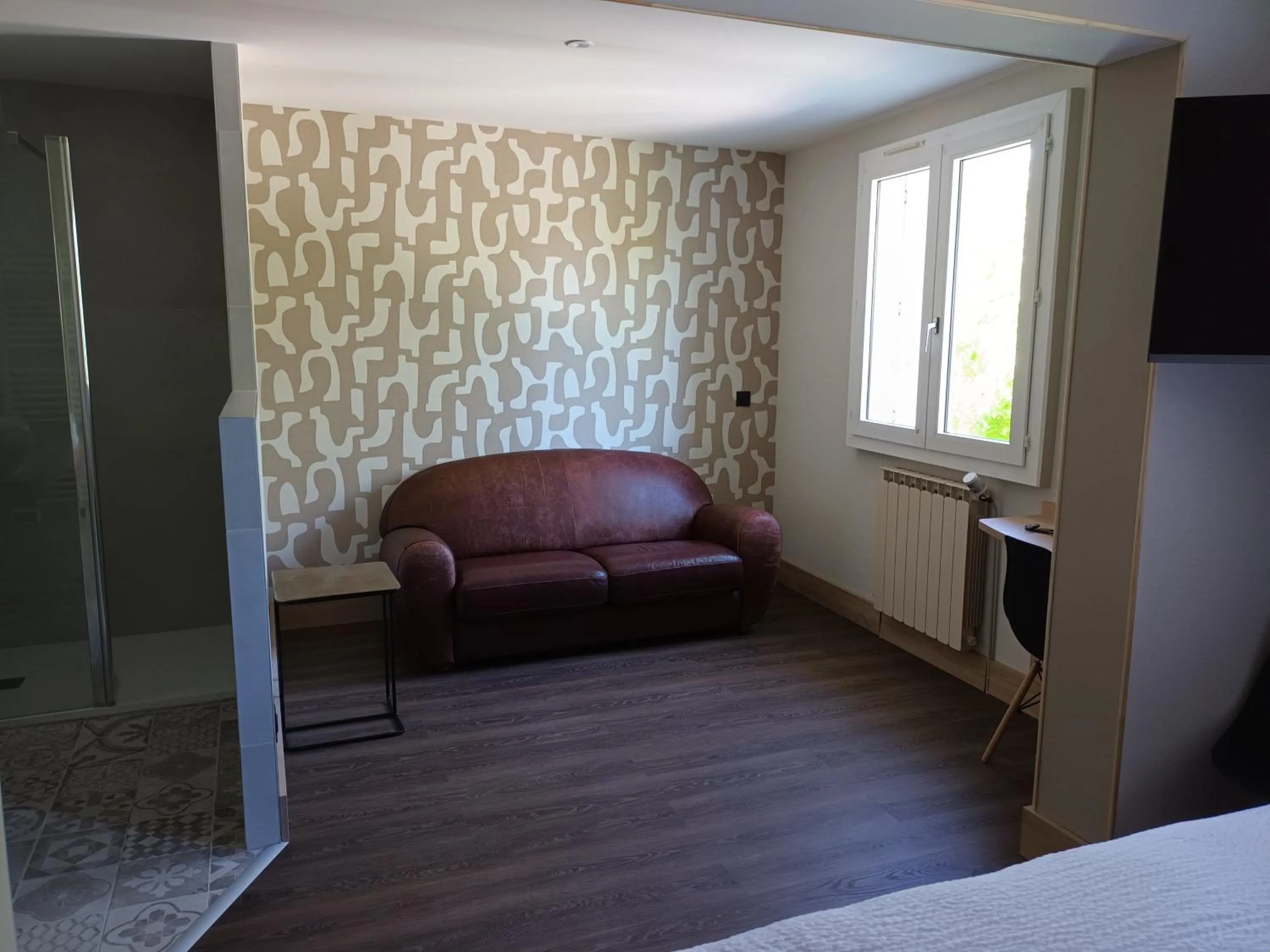 Seating area in Hôtel-Restaurant Logis l'Aubrac Laguiole