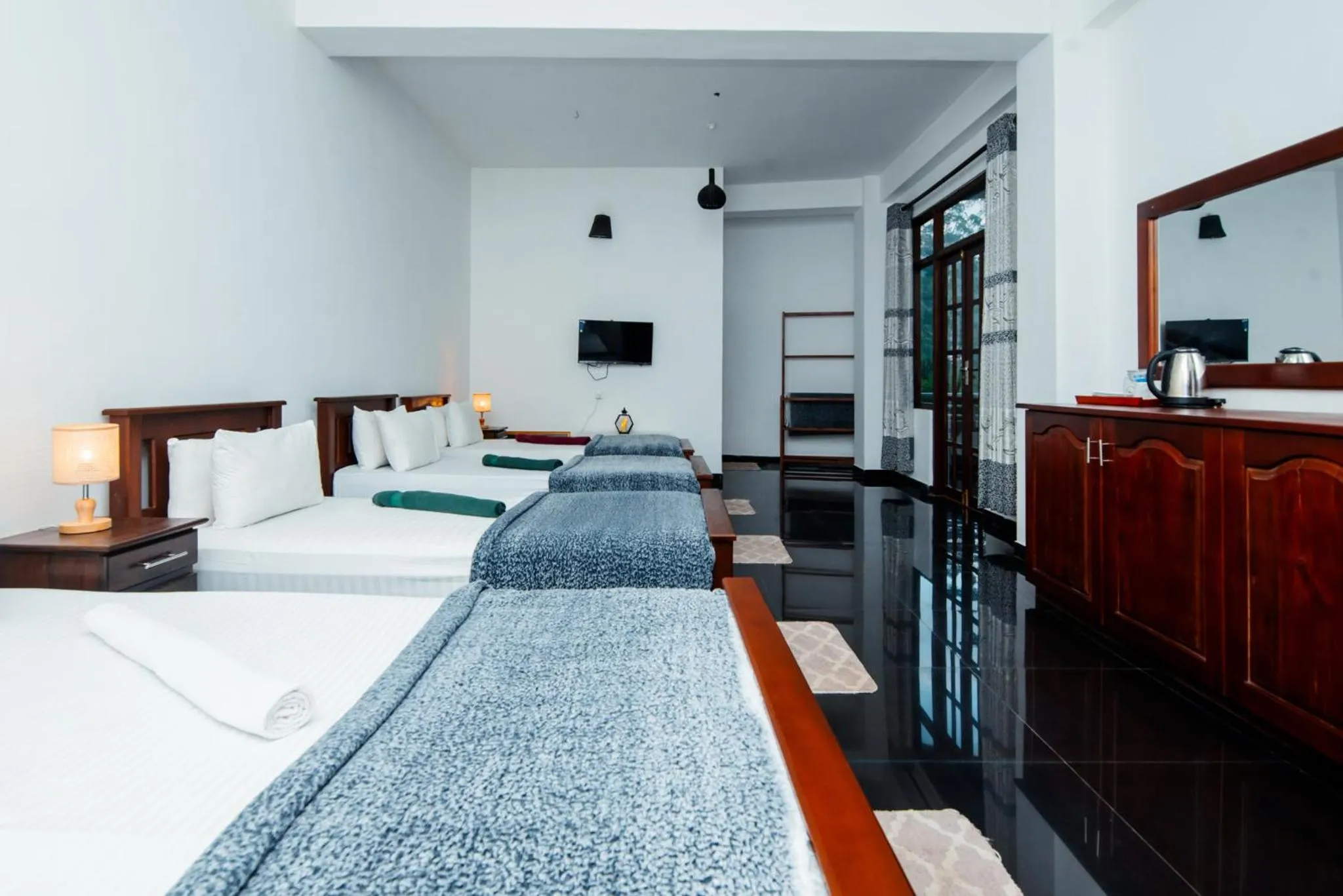 Bed in Adams Peak Inn