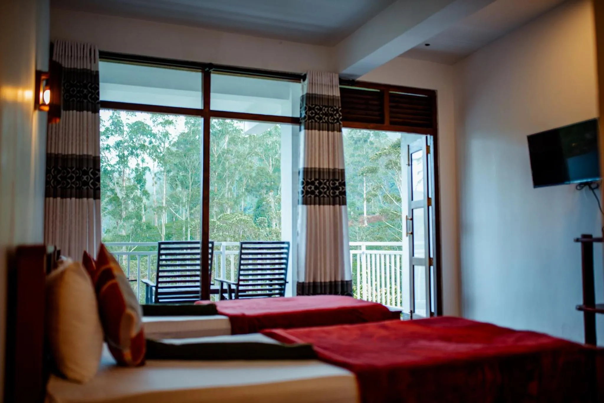 Bed in Adams Peak Inn