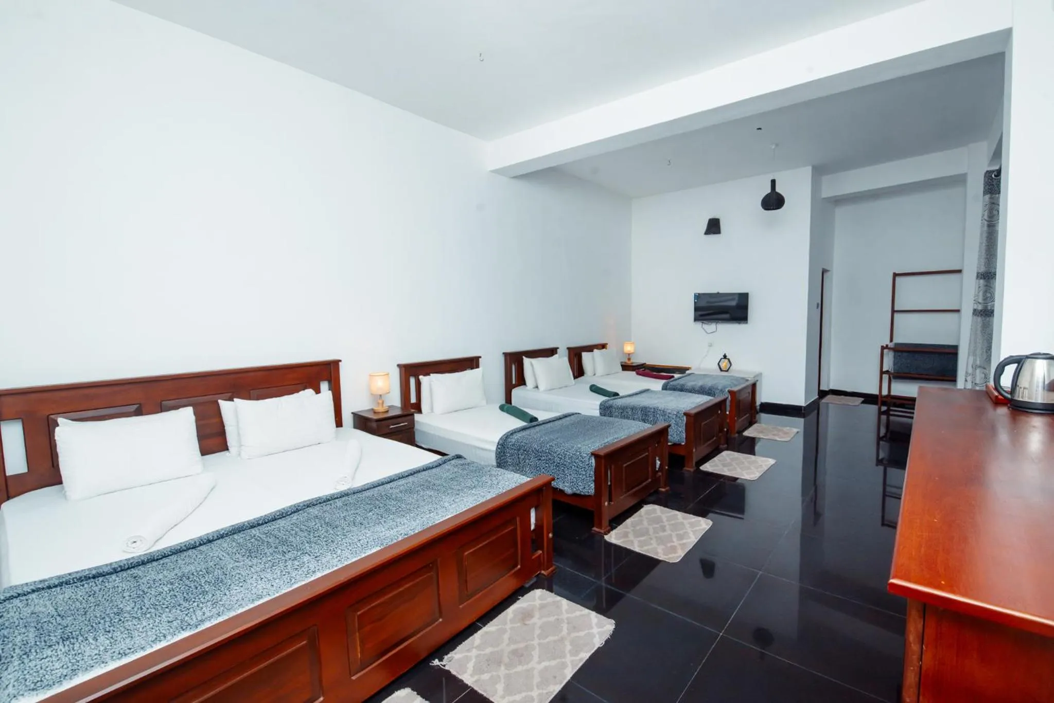 Bed in Adams Peak Inn