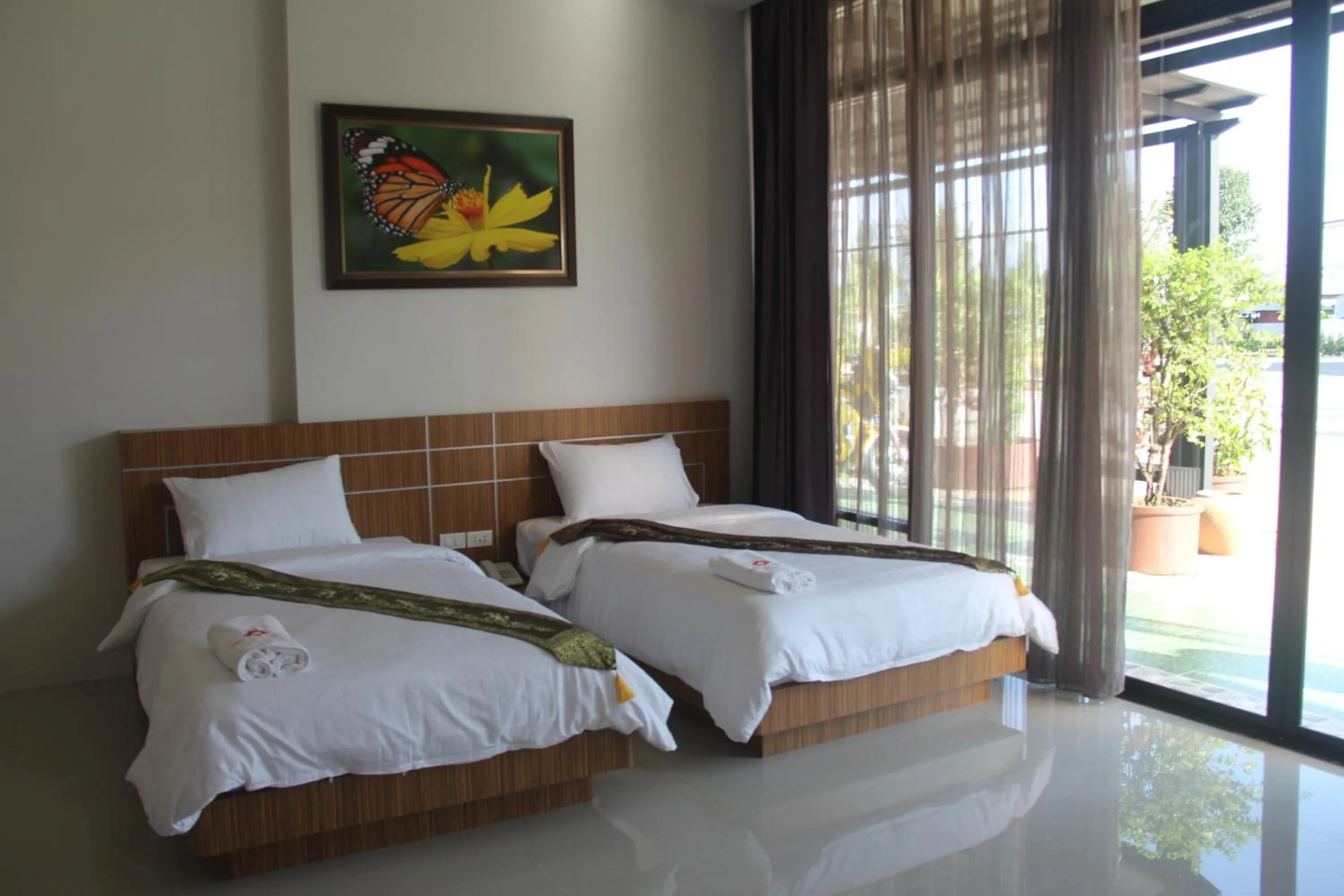 Bed in Tawan Anda Garden Hotel