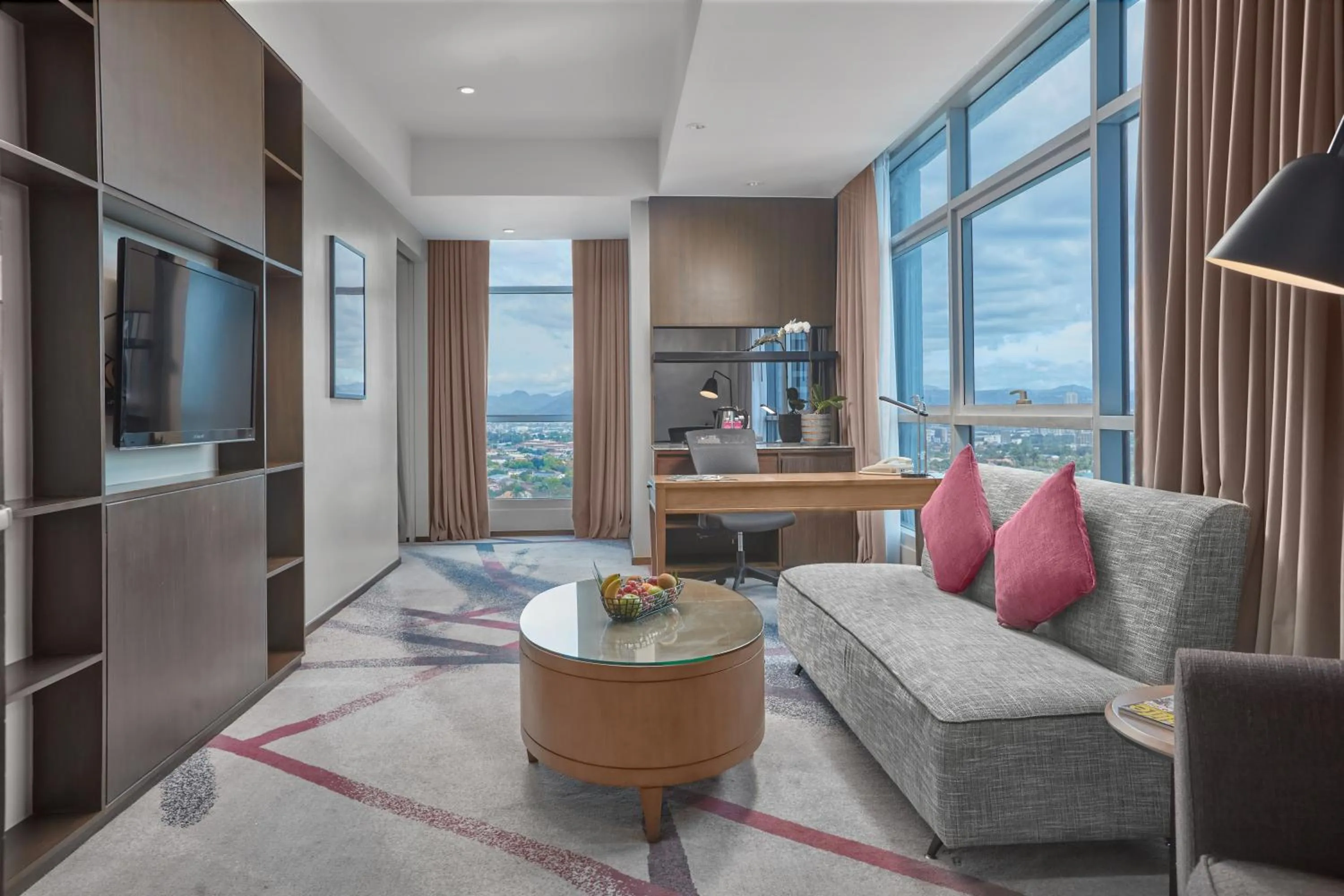 Living room in Crowne Plaza Manila Galleria by IHG