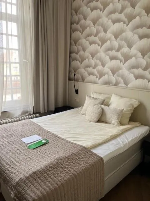 Bed in Amaryllis Hotel Veurne
