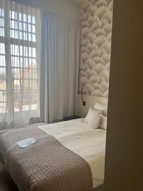 Bed in Amaryllis Hotel Veurne