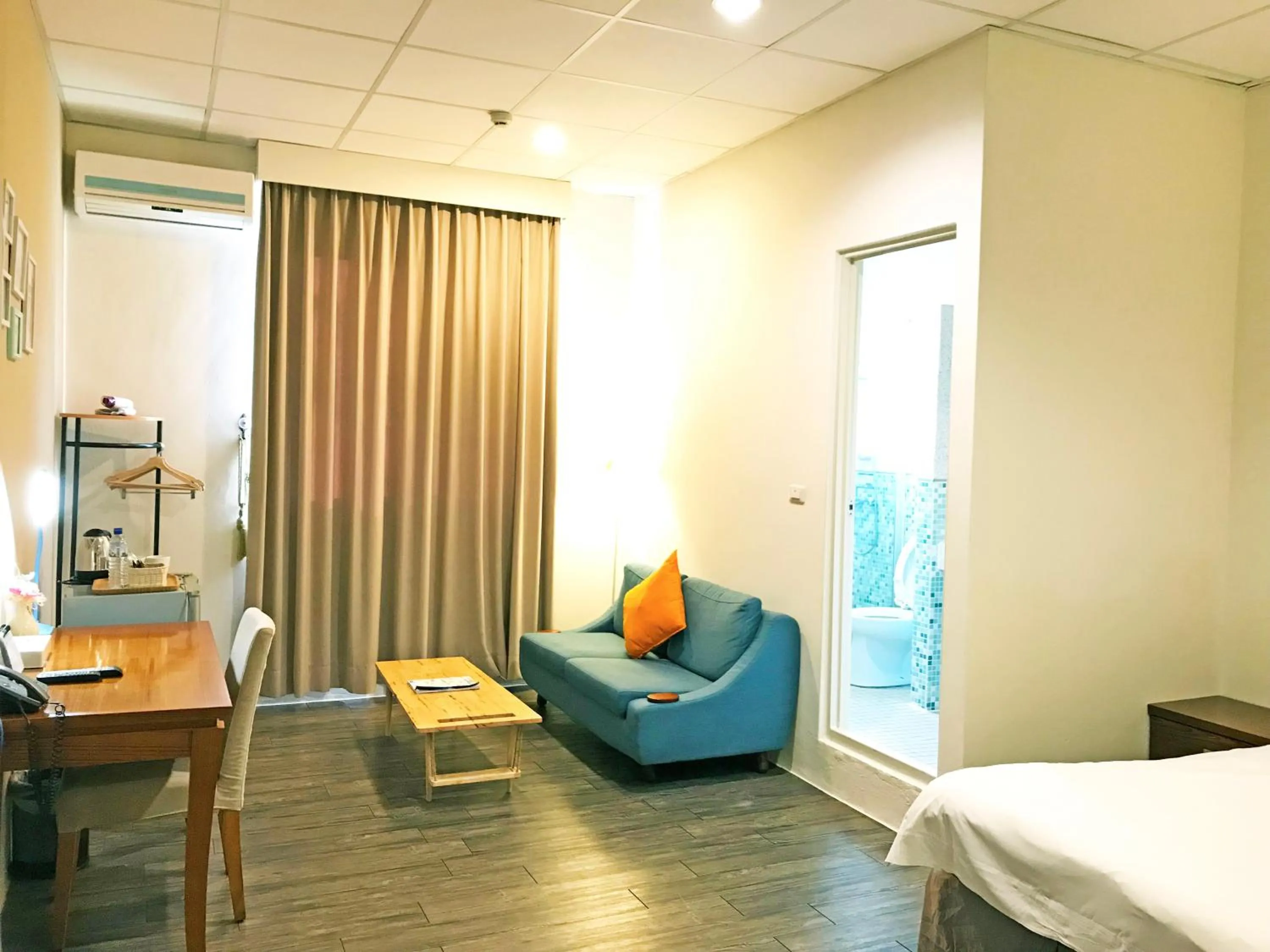 Living room, Bed in NCNU Campus Inn暨大行旅