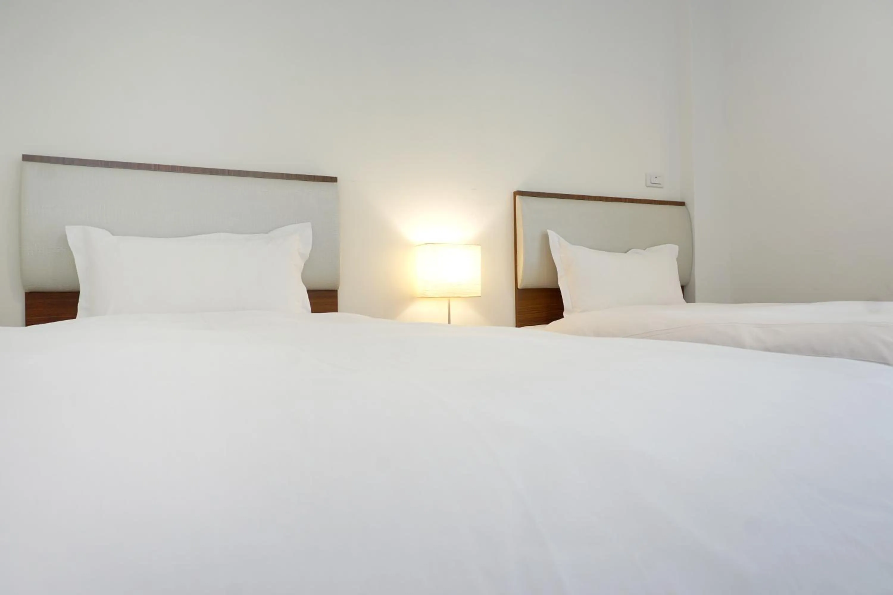 Bed in NCNU Campus Inn暨大行旅