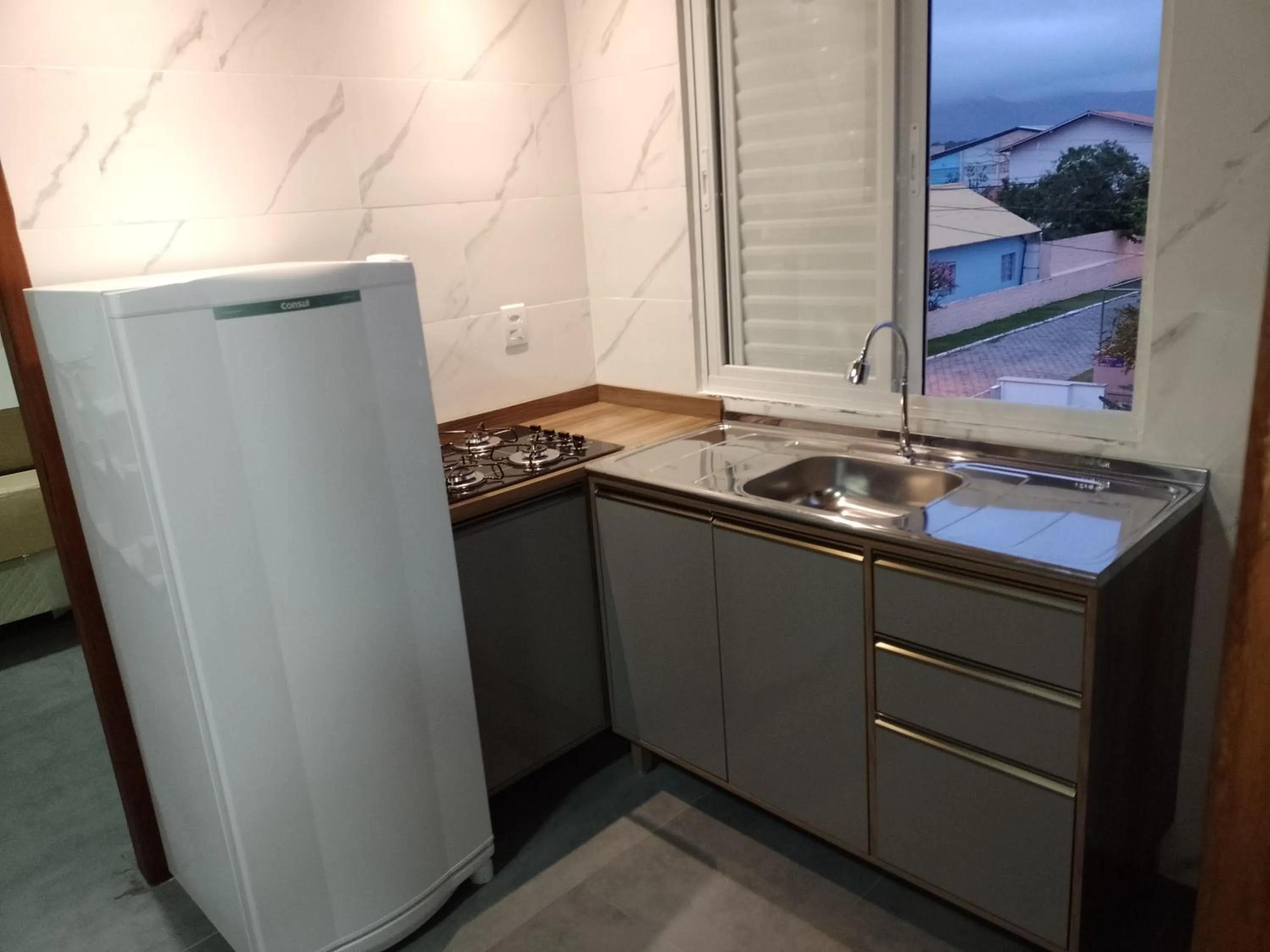 Kitchen or kitchenette in Pousada Oliveira