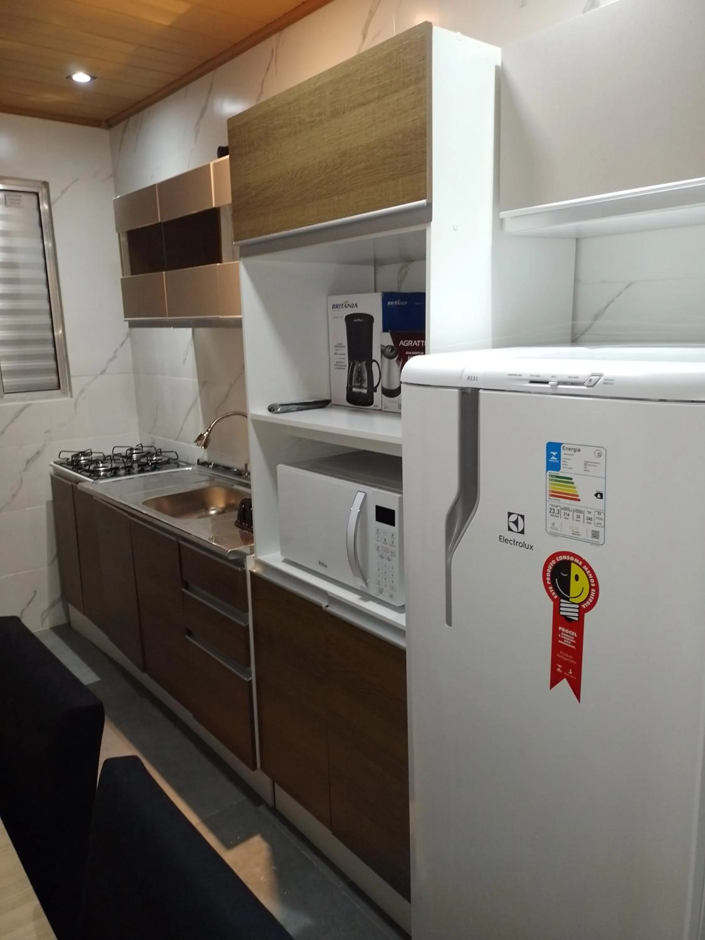 Kitchen or kitchenette in Pousada Oliveira