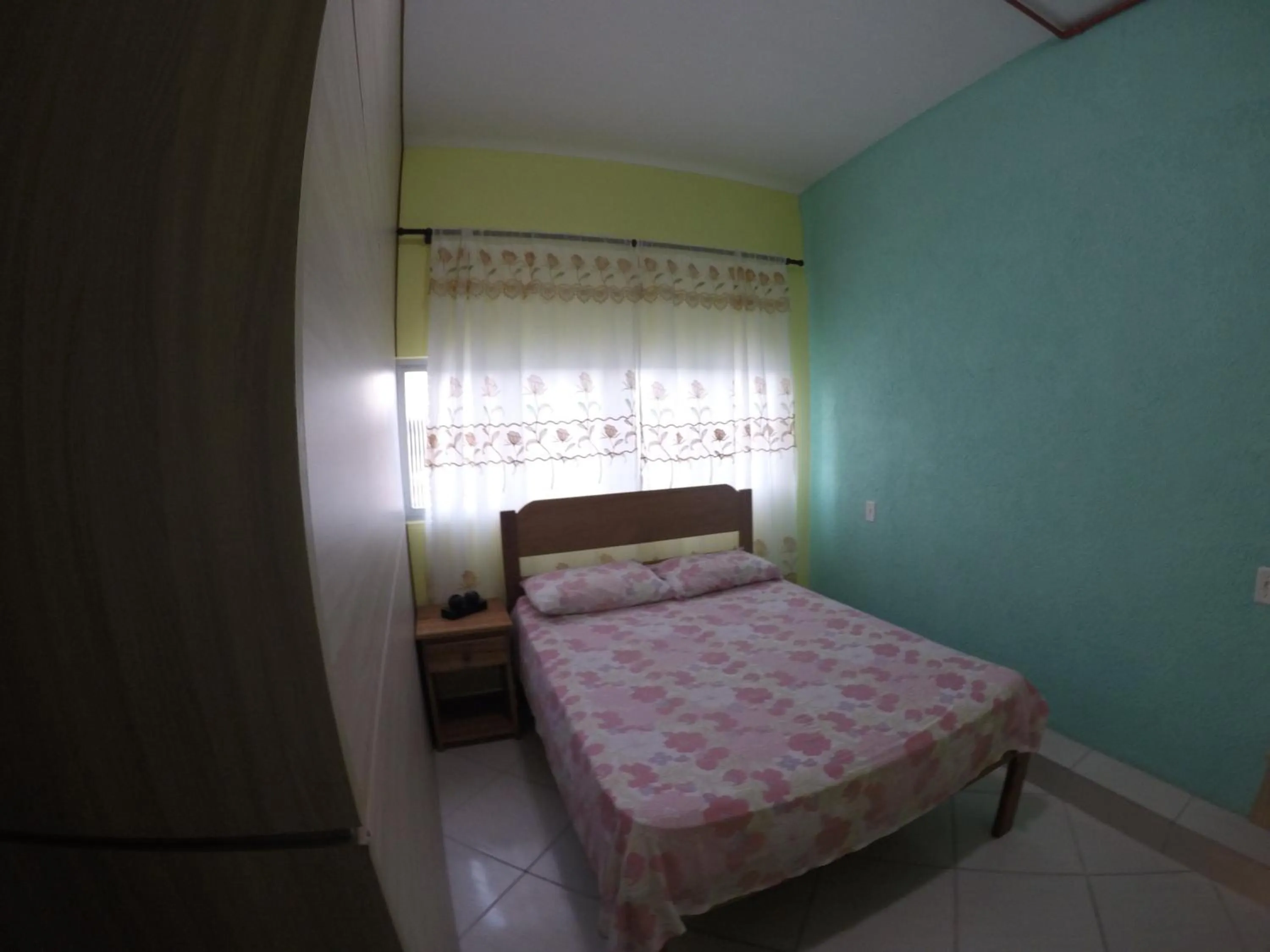 Bed in Pousada Oliveira