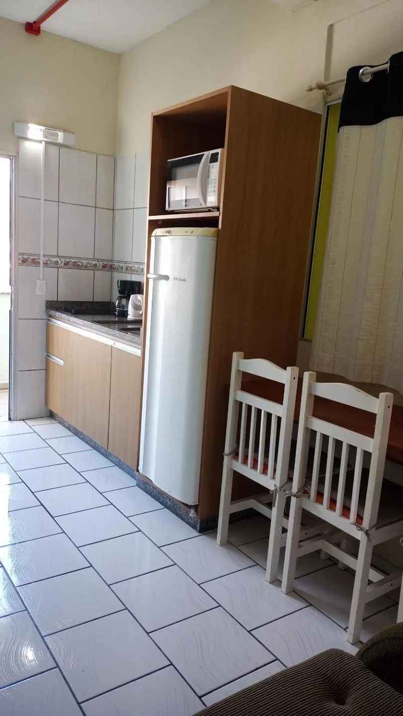 Kitchen or kitchenette in Pousada Oliveira
