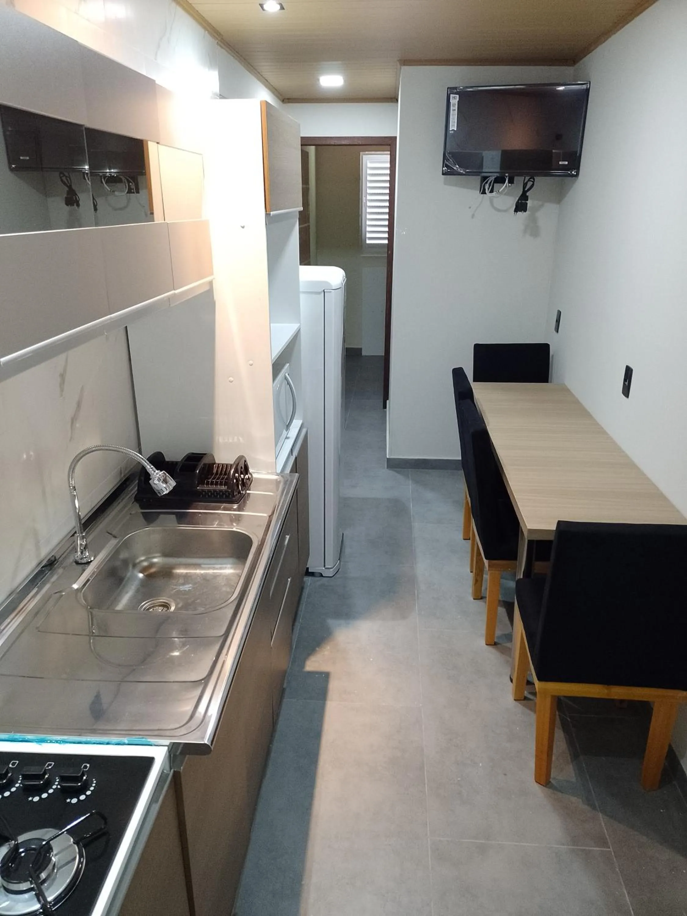 Kitchen or kitchenette in Pousada Oliveira