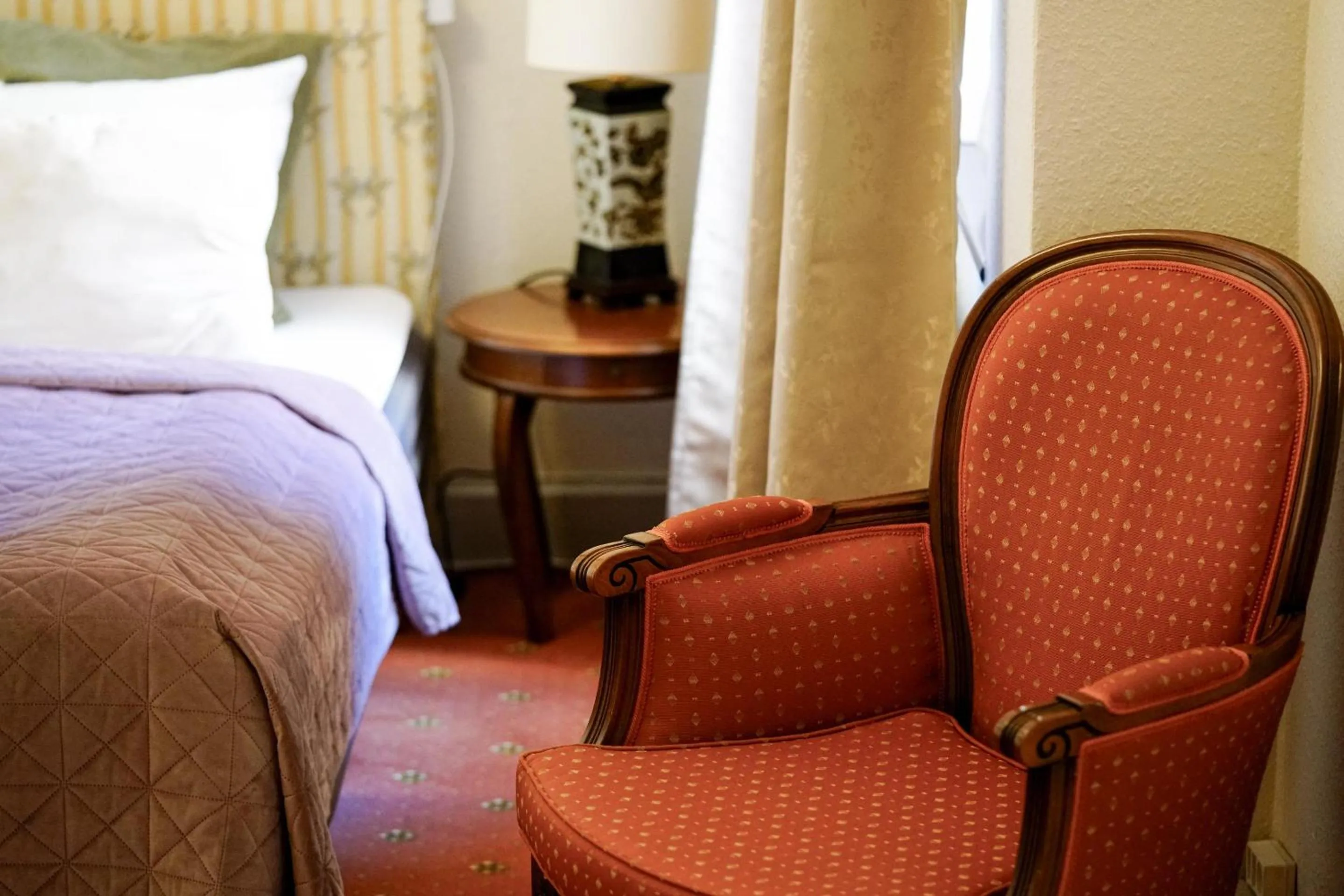 Seating area, Bed in Hotel Postgaarden