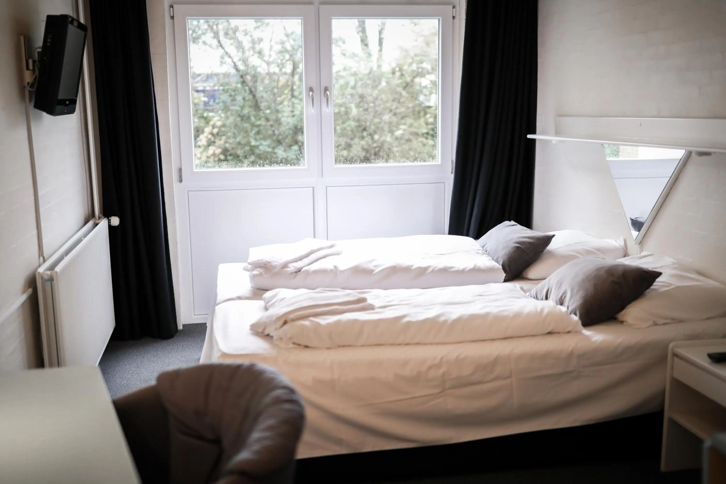 Bed in Dolphin Hotel Herning