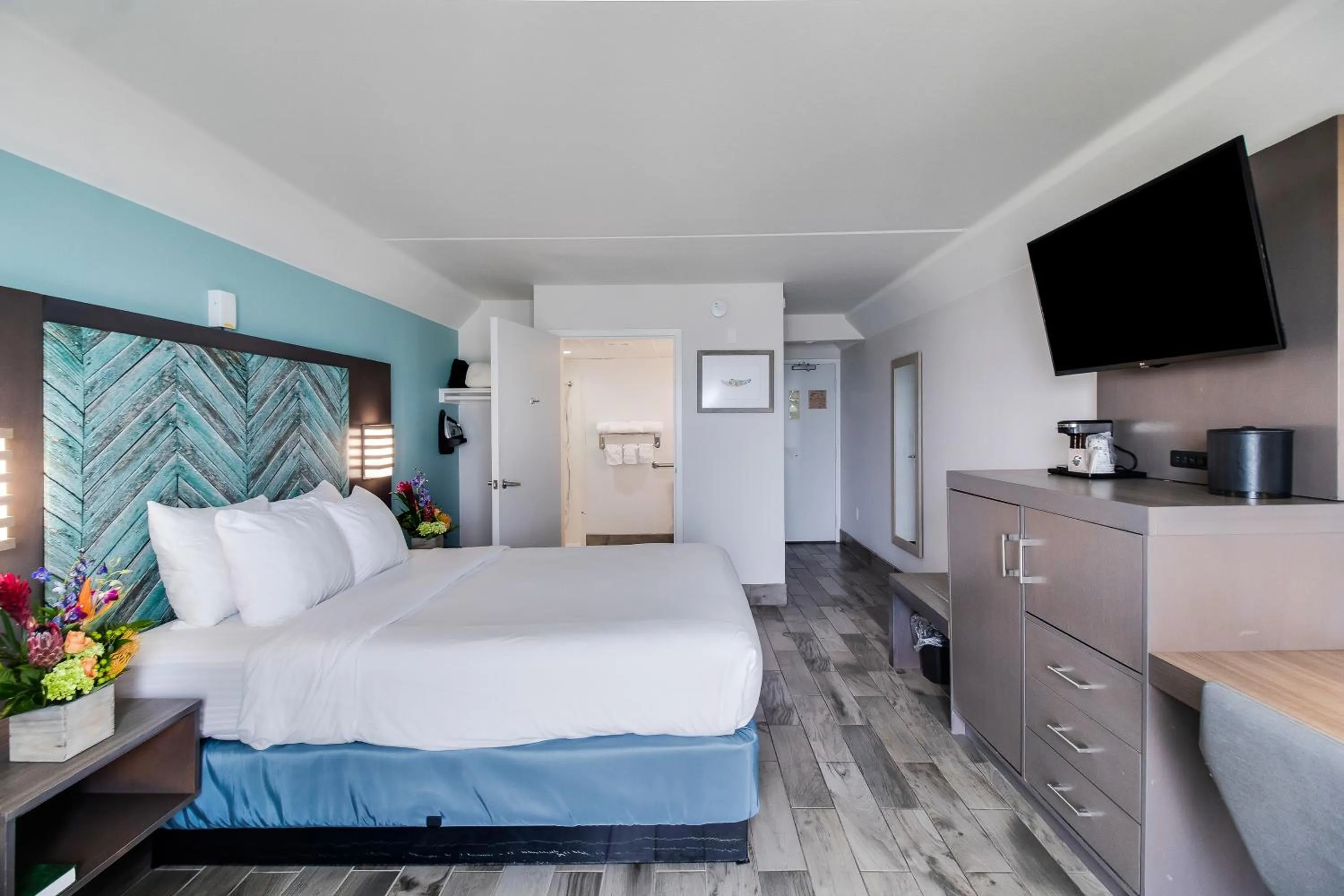 Bed in Crystal Coast Oceanfront Hotel