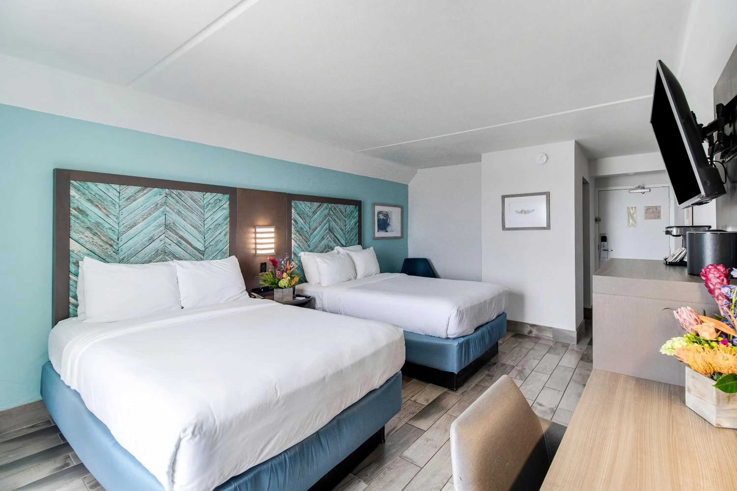 Bed in Crystal Coast Oceanfront Hotel