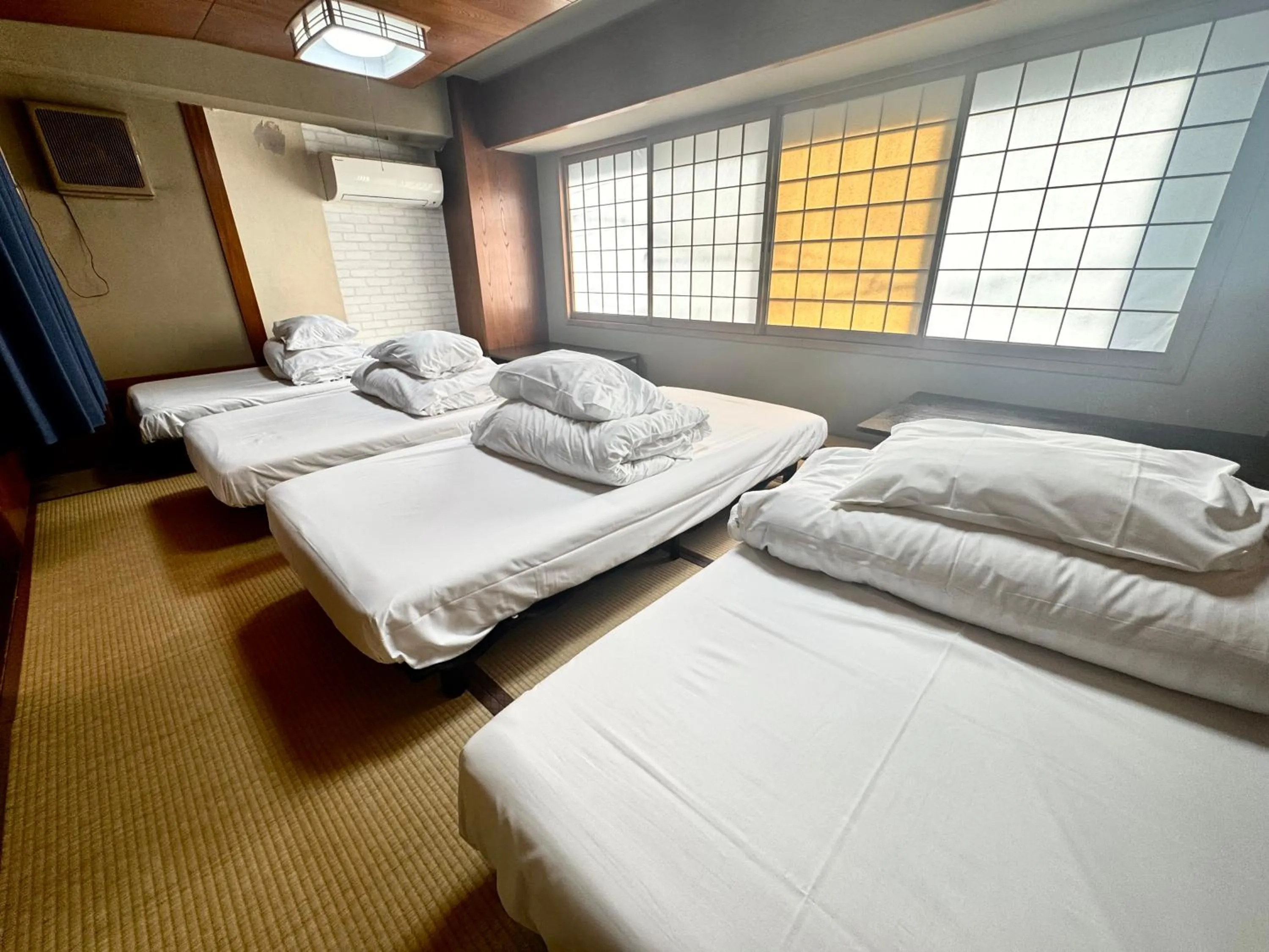 Bed in Osaka Guesthouse Sakura