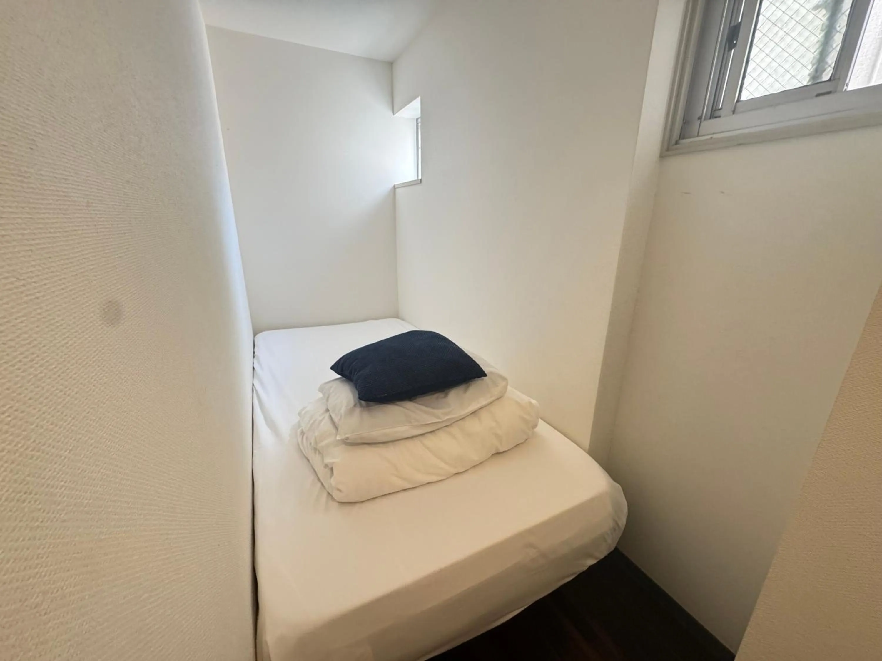 Bed in Osaka Guesthouse Sakura