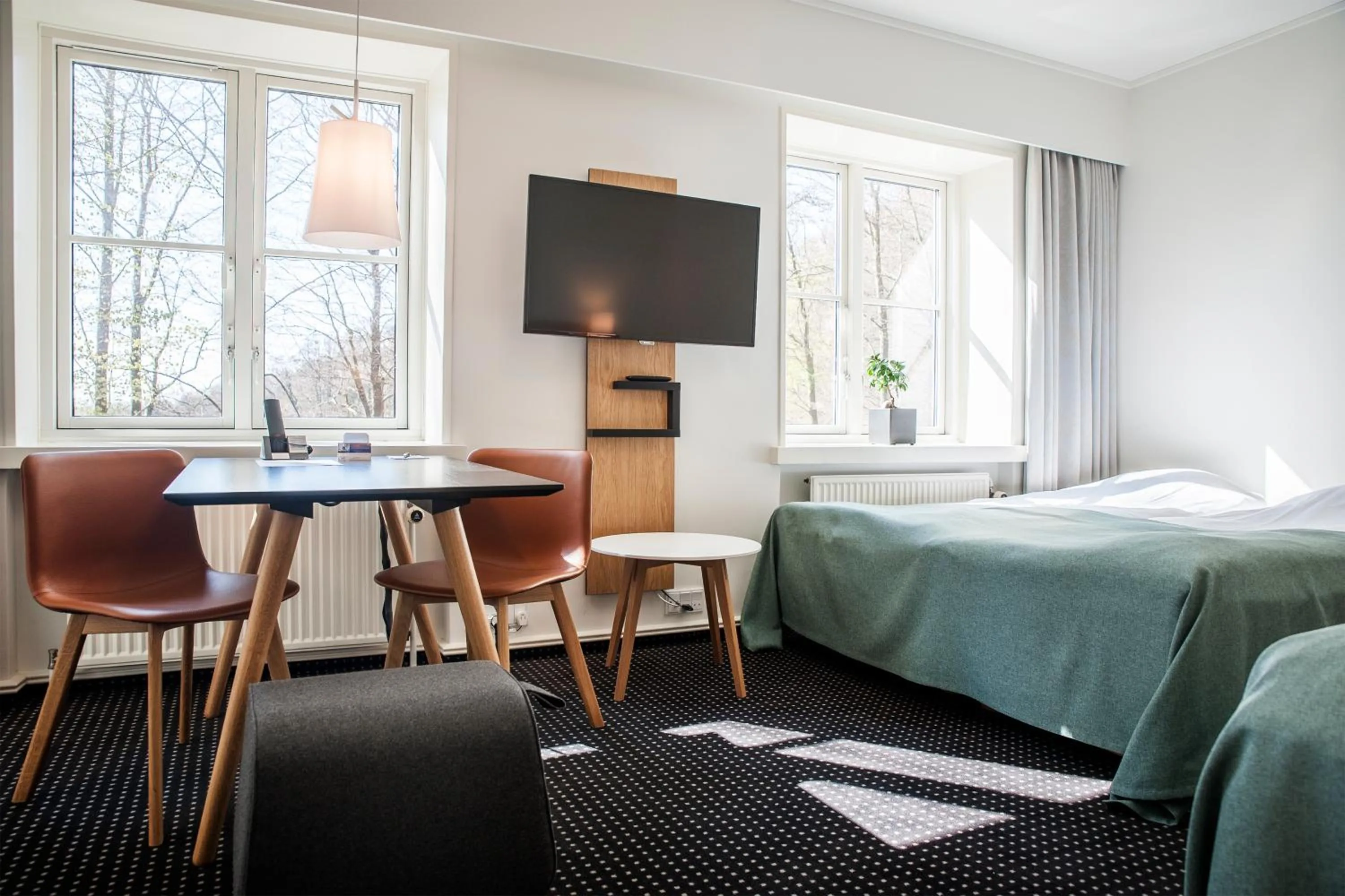 Communal lounge/ TV room, Bed in Hotel Koldingfjord