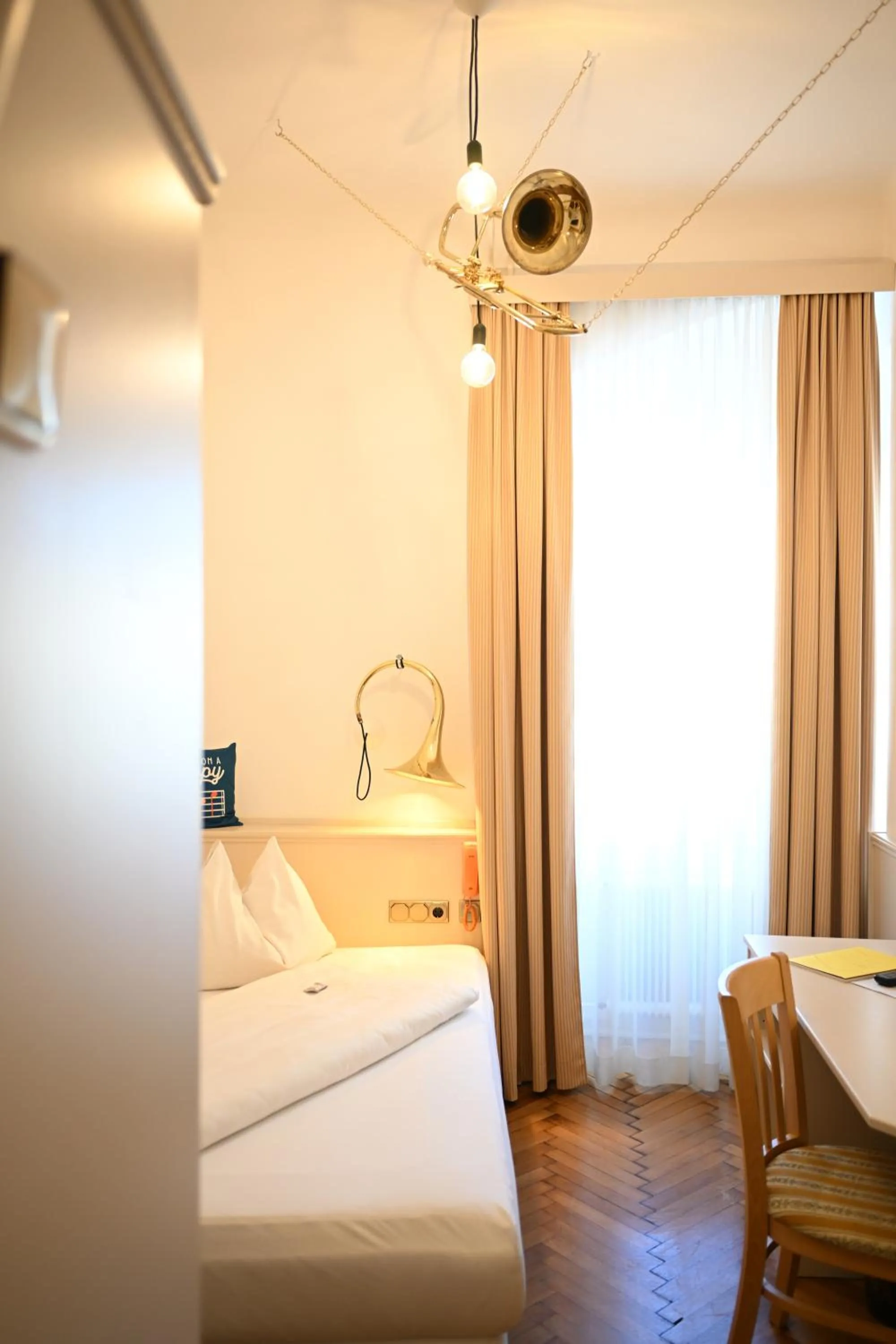 Photo of the whole room, Bed in Boutique Hotel Goldenes Lamm Villach