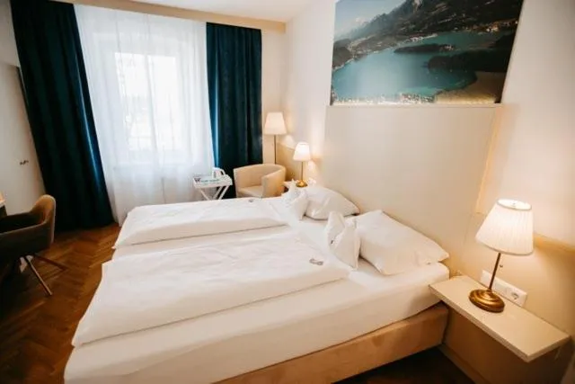 Photo of the whole room, Bed in Boutique Hotel Goldenes Lamm Villach