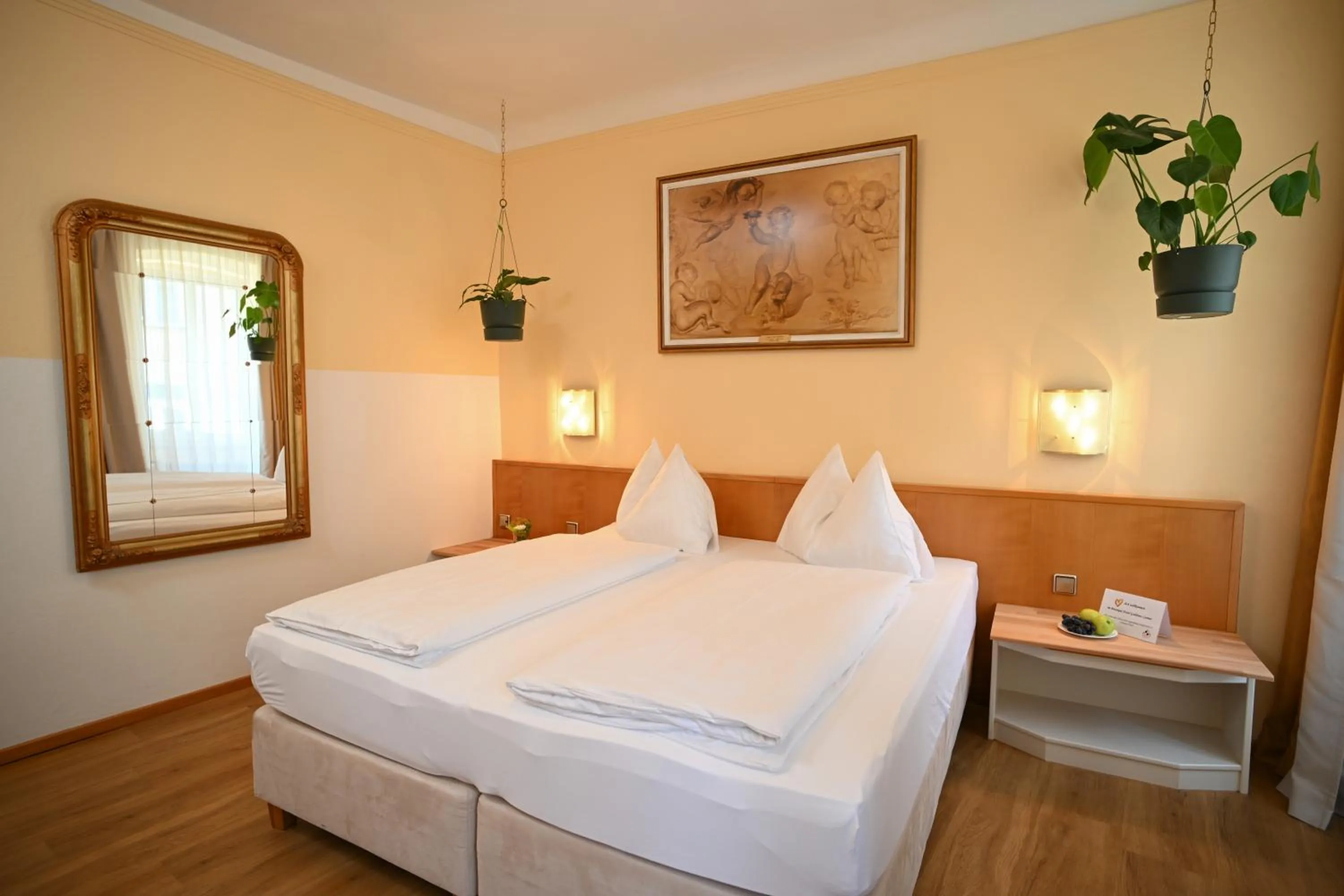 Photo of the whole room, Bed in Boutique Hotel Goldenes Lamm Villach