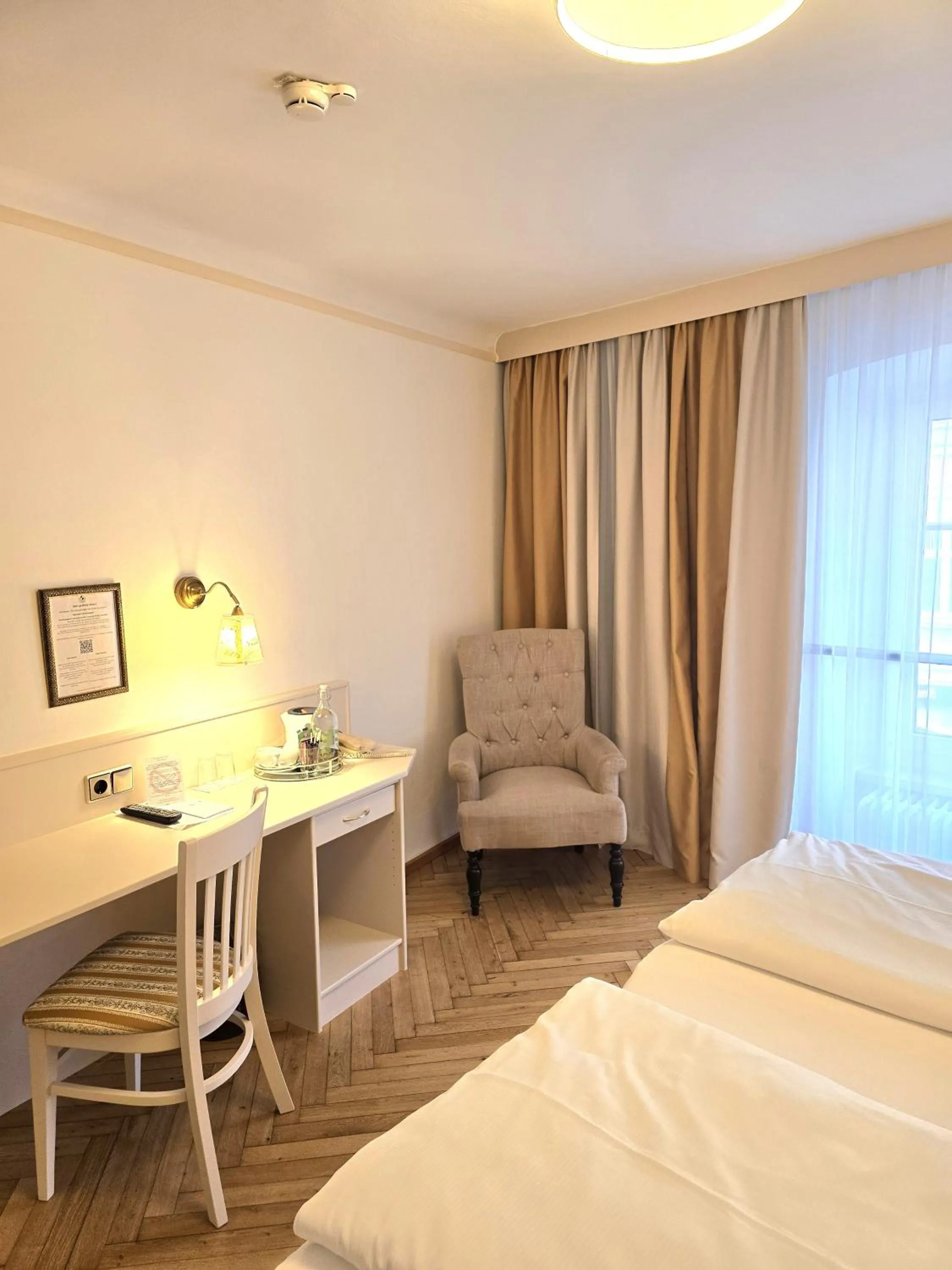 Photo of the whole room, Bed in Boutique Hotel Goldenes Lamm Villach